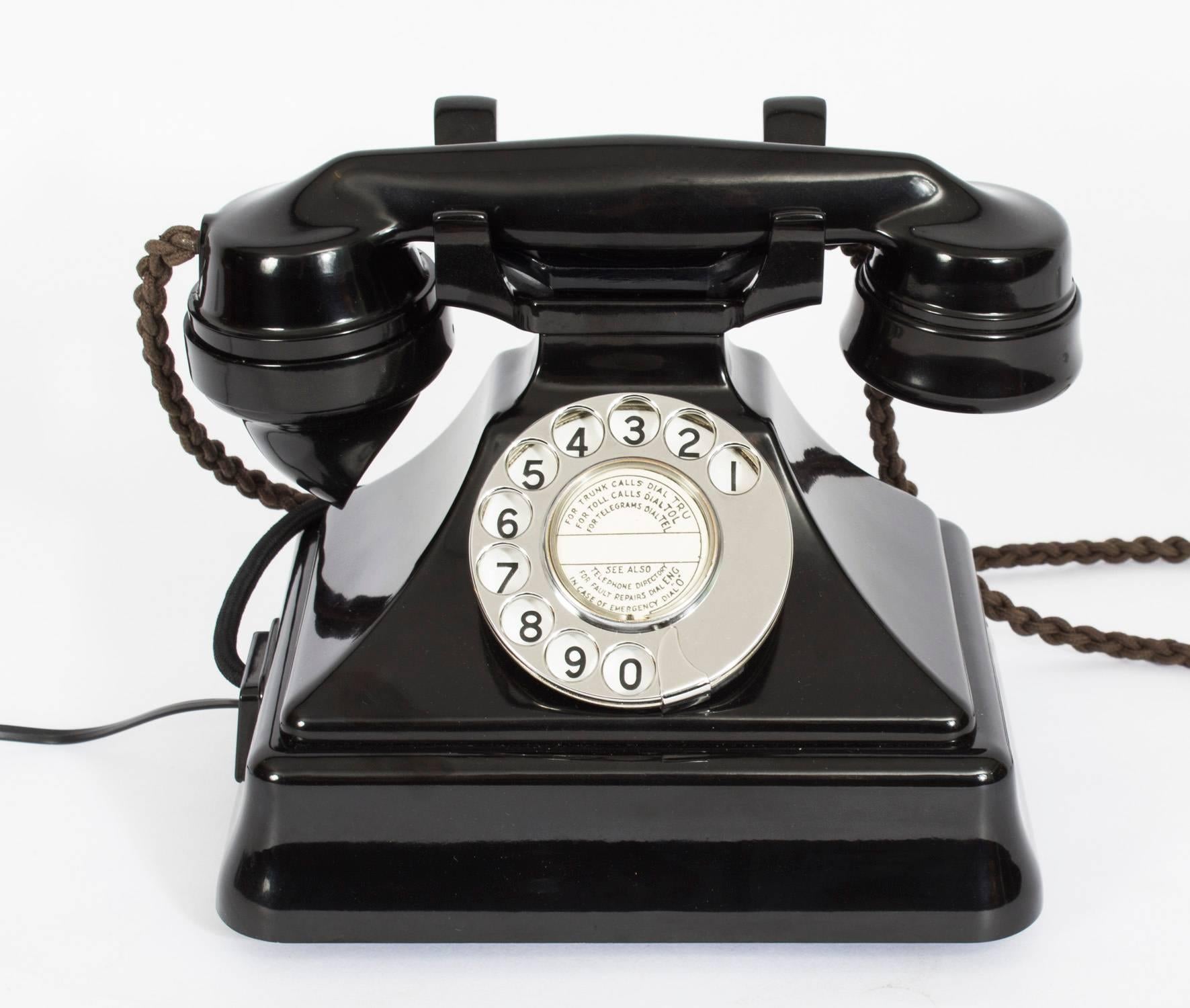 This is a rare GPO series 162 telephone, dated 1937 in black Perspex Bakelite and manufactured by The Pyramid Telephone Manufacturing Co Ltd.

The Telephone 162 was the first to be adopted by the British Post Office in 1929. It was based on a