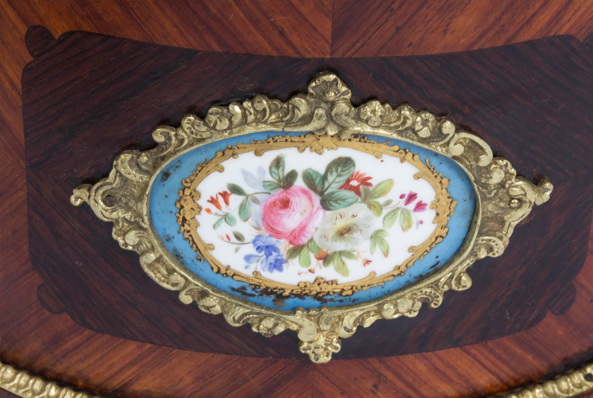This is a beautiful antique French ormolu and Sèvres porcelain mounted, kingwood jardiniere, circa 1870 in date.

The jardiniere is serpentine in shape with ormolu mounts enclosing enchanting floral hand-painted Sèvres Porcelain plaques,