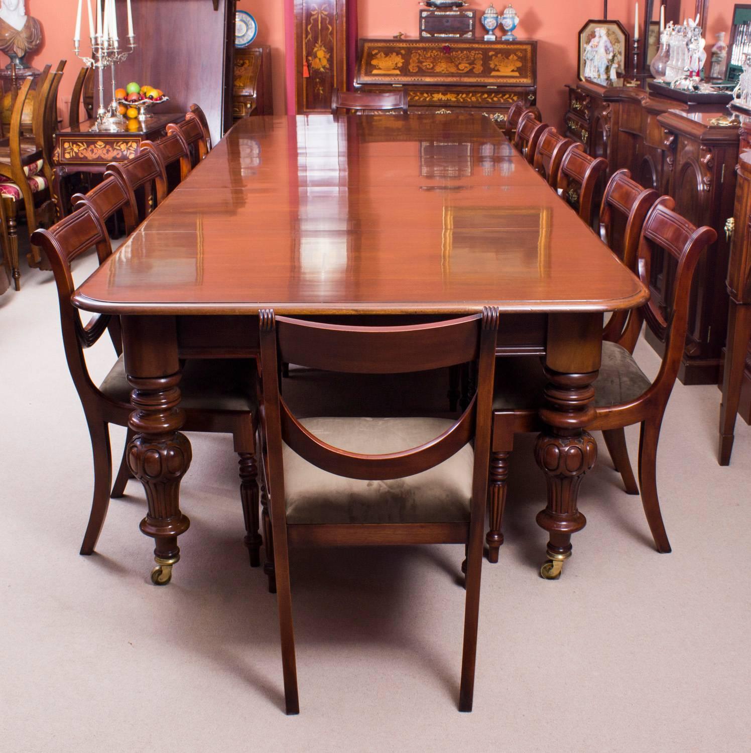 This is a beautiful flame mahogany Victorian antique dining table dating from the 1860s.

This amazing antique dining table can seat fourteen people in comfort and has been hand-crafted in solid flame mahogany which is renowned for its beautiful