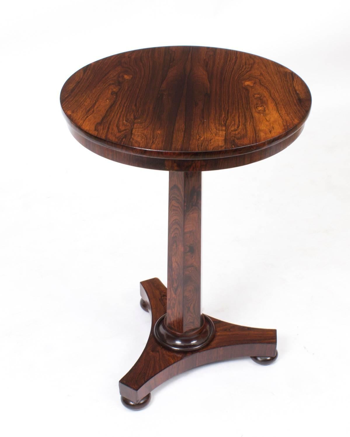 This is a superb antique William IV rosewood occasional table, circa 1830 in date.
It is crafted from beautiful rosewood and is raised on a hexagonal column with a triparte base that rests on bun feet.
This elegant occasional table will make a