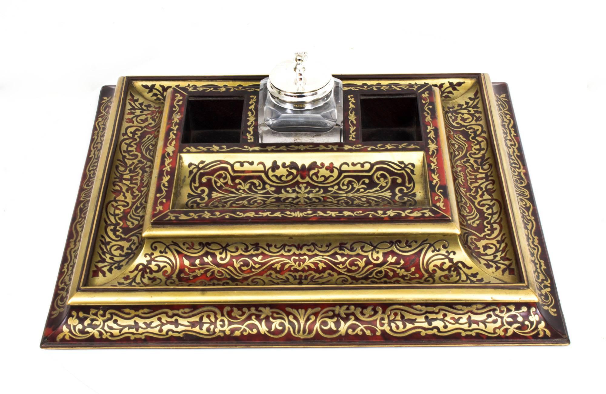 This is an absolutely stunning antique French Boulle & cut brass inkstand circa 1860 in date. 

It is expertly inlaid with foliate stylised foliage decoration in cut brass,
There is a beautiful quill tray which provides ample storage for your