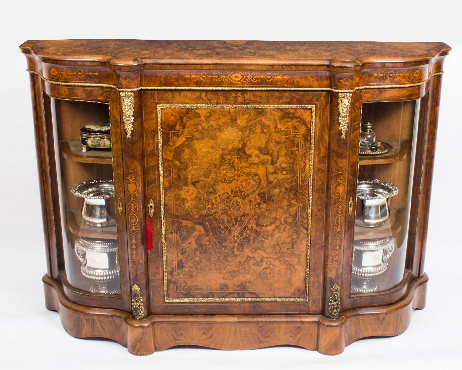 This is a wonderful antique Victorian burr walnut inlaid and ormolu-mounted credenza, circa 1860 in date.

Oozing sophistication and charm, this credenza is the absolute epitome of Victorian High Society. Its attention to detail and lavish