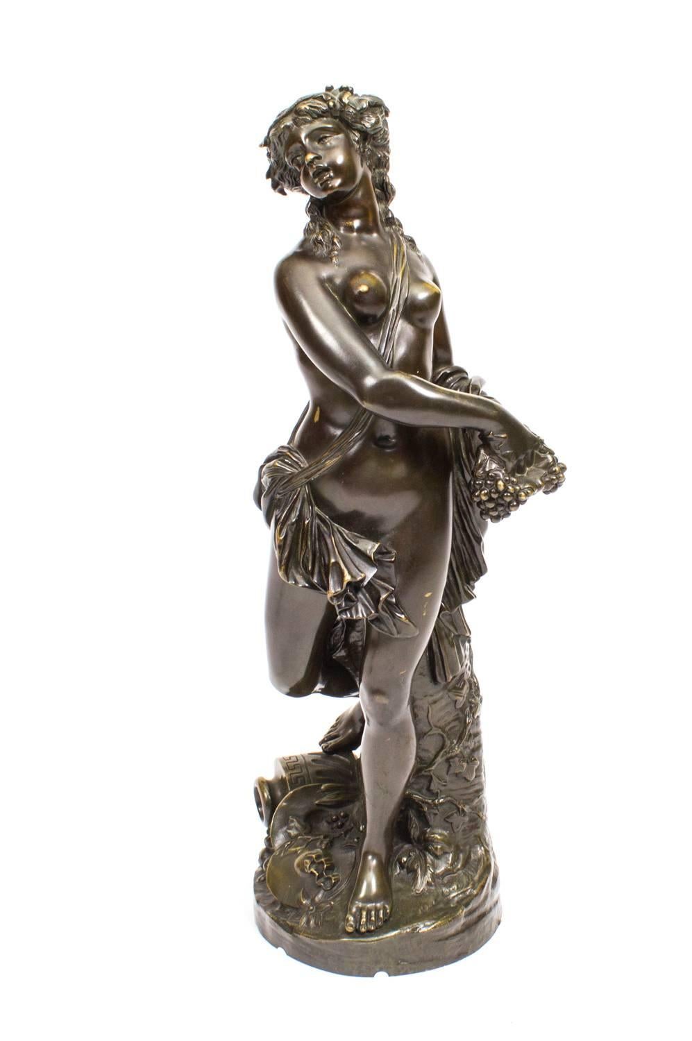 This is a beautiful antique French dark patinated bronze Bacchante sculpture after Clodion ( 1738-1814) and C1880 in date.

This stunning bronze is superbly cast with a brown patina representing a naked Bacchante against a tree with ivy twisted