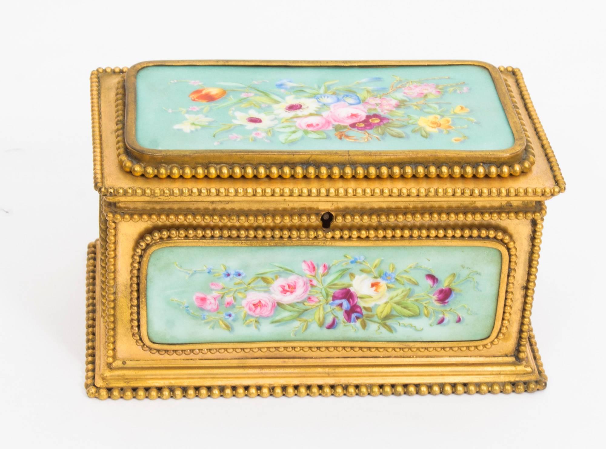 A French porcelain and gilt metal mounted casket, Tahan à Paris, the porcelain panels painted flowers on a turquoise ground, beaded borders, 17cm wide.

This is a beautiful antique porcelain and ormolu-mounted rectangular shaped jewel casket, by