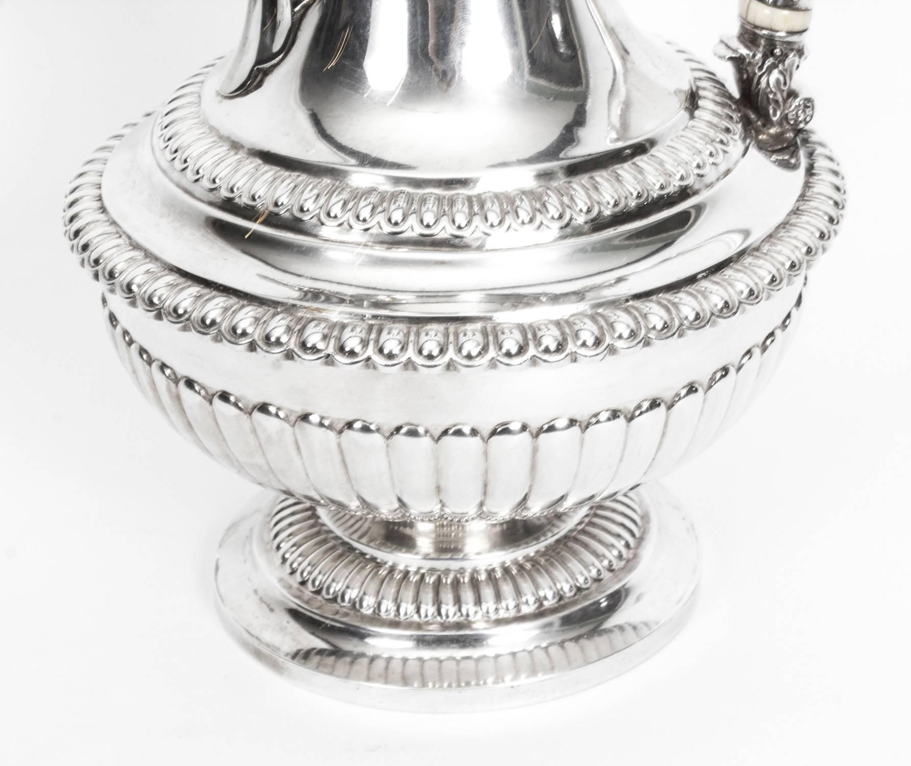 This is a really superb quality antique sterling silver coffee pot /ewer with hallmarks for London 1818 and the makers mark of one of the most celebrated silversmiths  Rebecca Emes & Edward Barnard.

It has stunning gadrooned and reeded