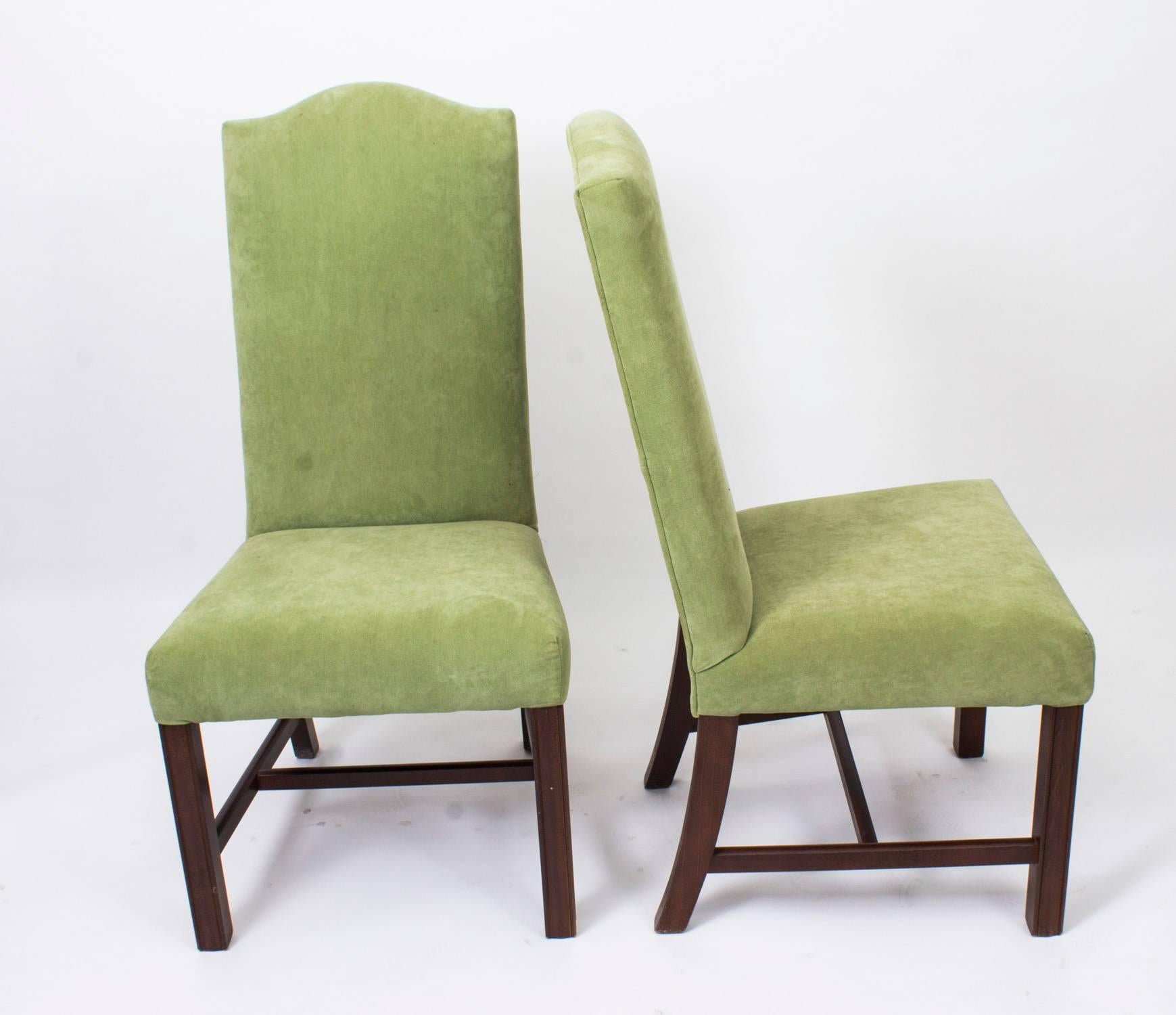 An absolutely fantastic English made set of ten padded highback dining chairs, dating from the second half of the 20th century.

These chairs have been masterfully hand crafted, and the set comprises ten side chairs all of which feature an
