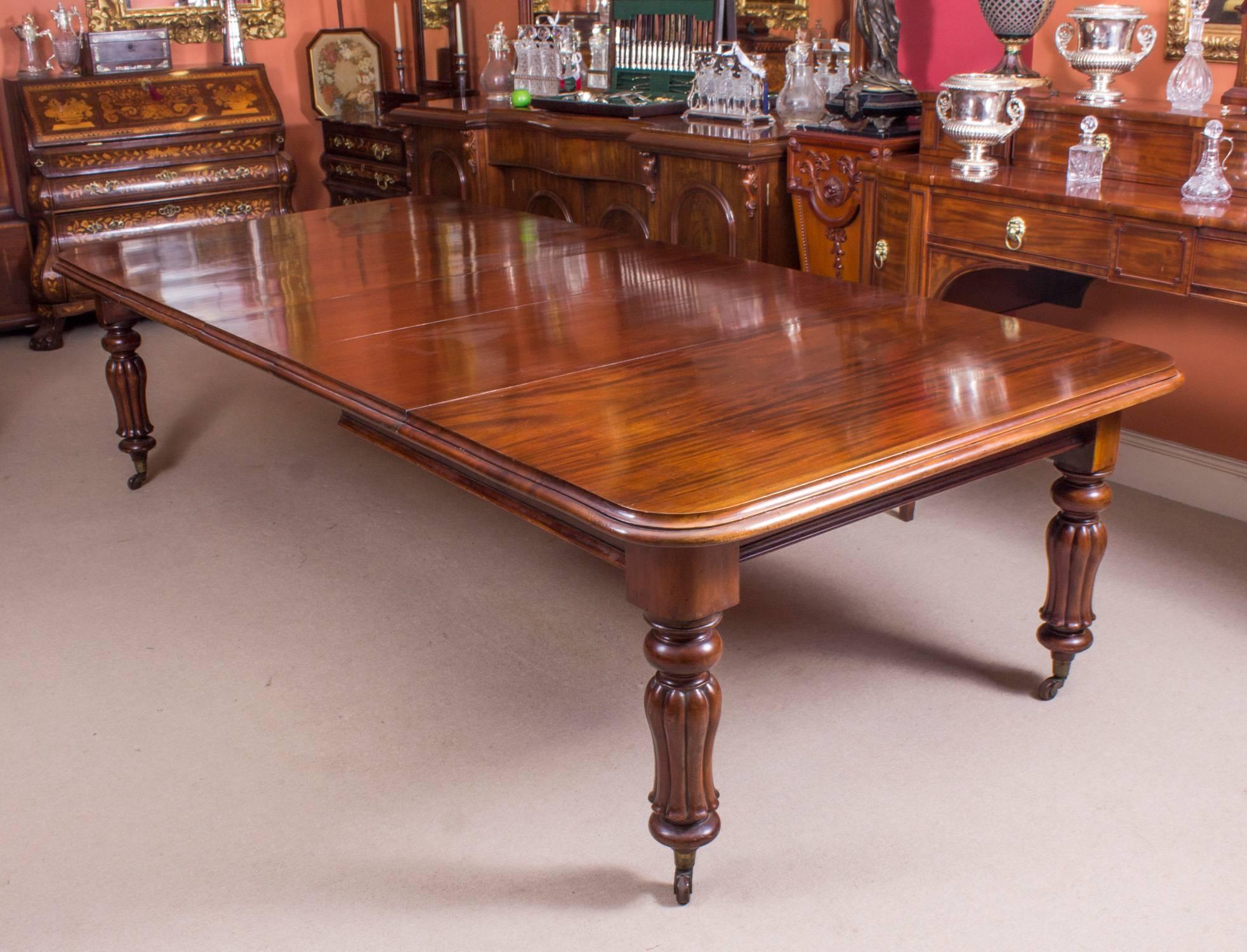 This is a fantastic dining set comprising of an antique William IV dining table, circa 1830 in date, with a vintage set of twelve balloon back dining chairs.

This beautiful table is in stunning flame mahogany and has three leaves of approximately
