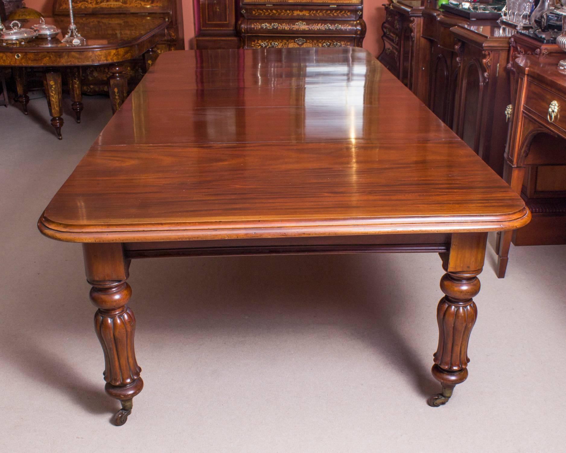 This is a magnificent antique William IV solid mahogany dining table which can seat twelve and is also ideal for use as a conference table, circa 1830 in date.

This beautiful table is in stunning flame mahogany and has three leaves of