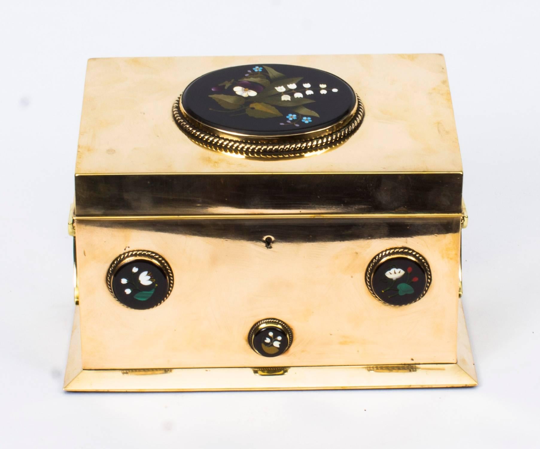 This is a superb quality antique French ormolu and Pietra Dura stationery box, circa 1860 in date.

With a large inset polished pietra dura to the hinged lid with a further three to the front and three to the rear, with a decorative ormolu drop