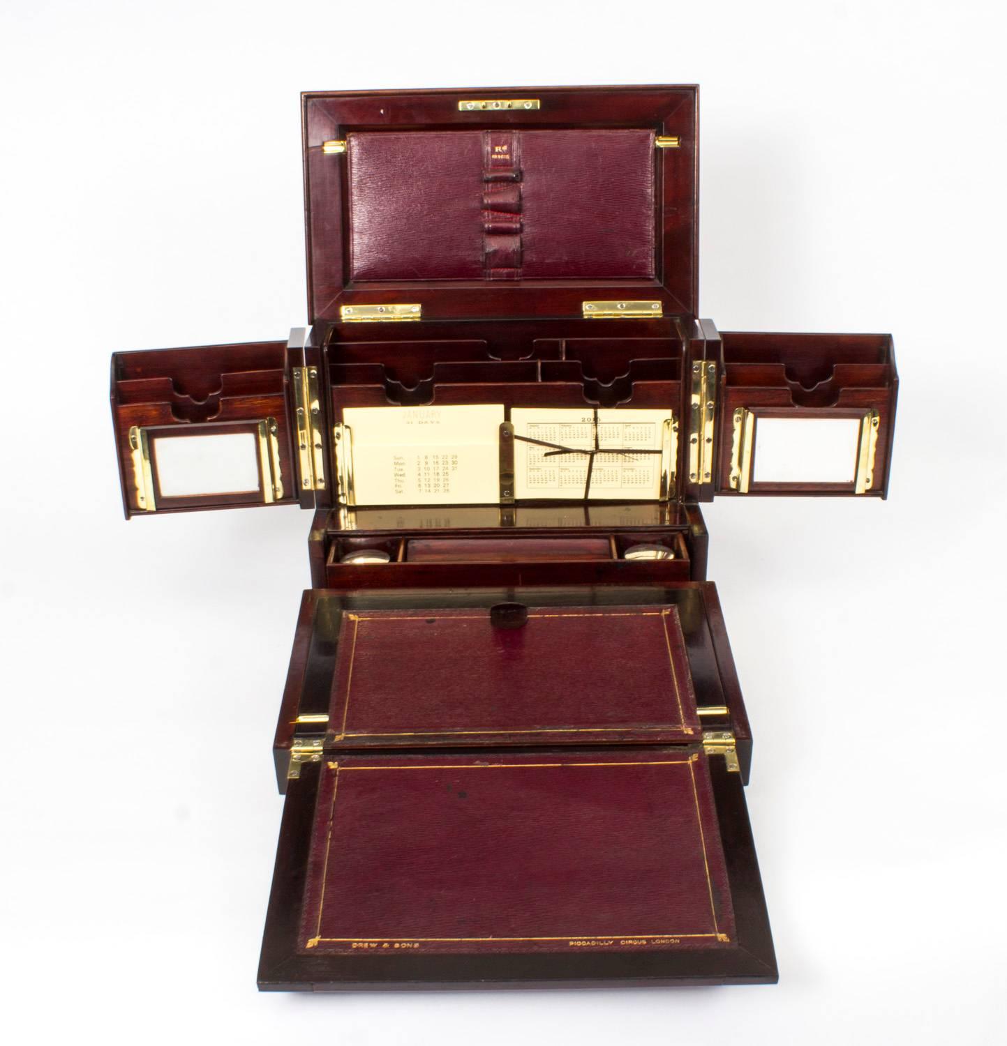 This is a magnificent antique Victorian inlaid black walnut and mahogany writing slope and stationery box compendium, circa 1860 in date, and bearing the name of the renowned box maker and retailer Drew & Sons, of Piccadilly Circus,