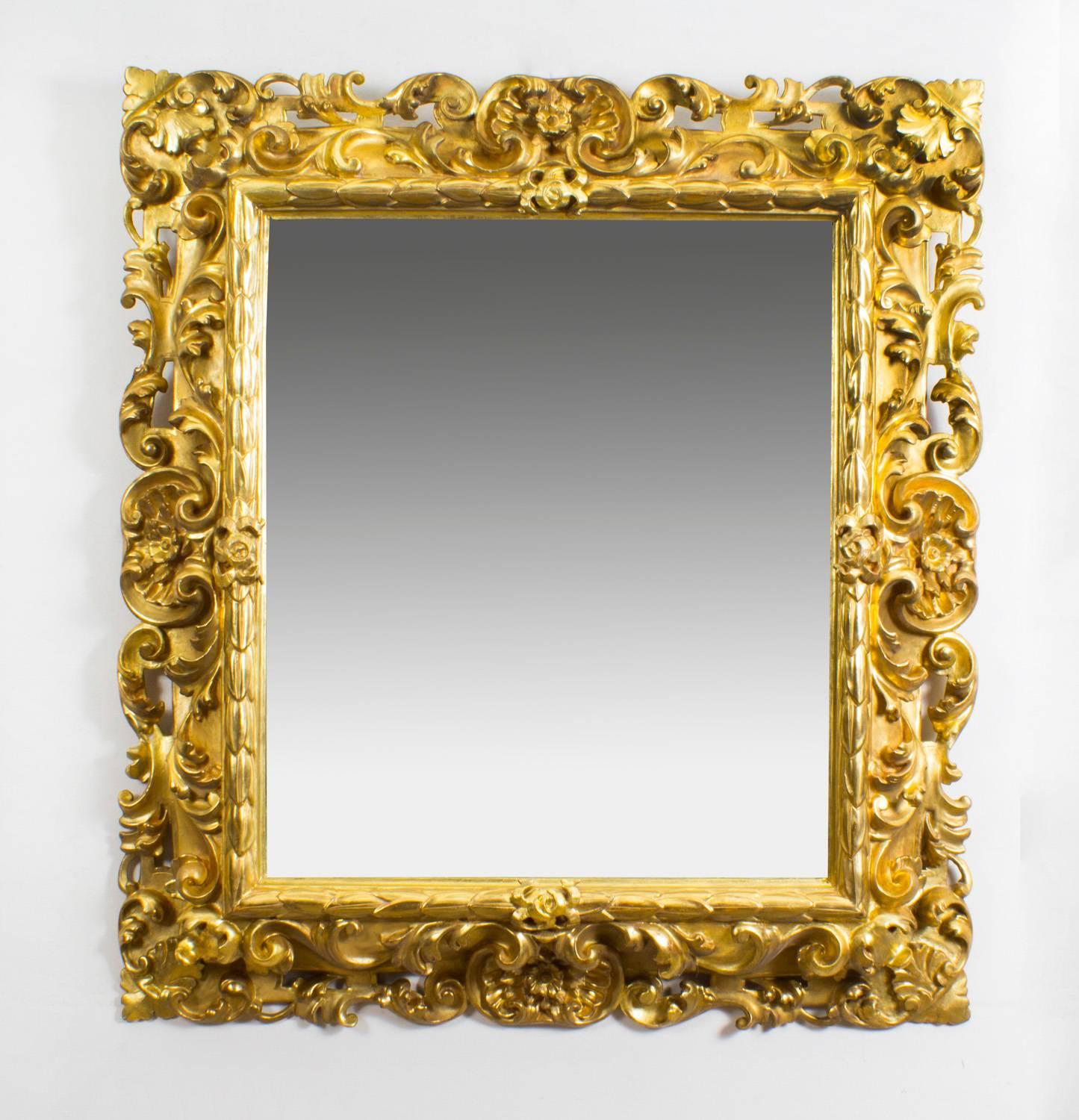 This is a superb pair of antique Italian Florentine giltwood mirrors, circa 1870 in date. 
The rectangular mirrors plates are within a boldly-carved scrolling acanthus frame, with a beaded inner border.

Florentine style refers to the art and