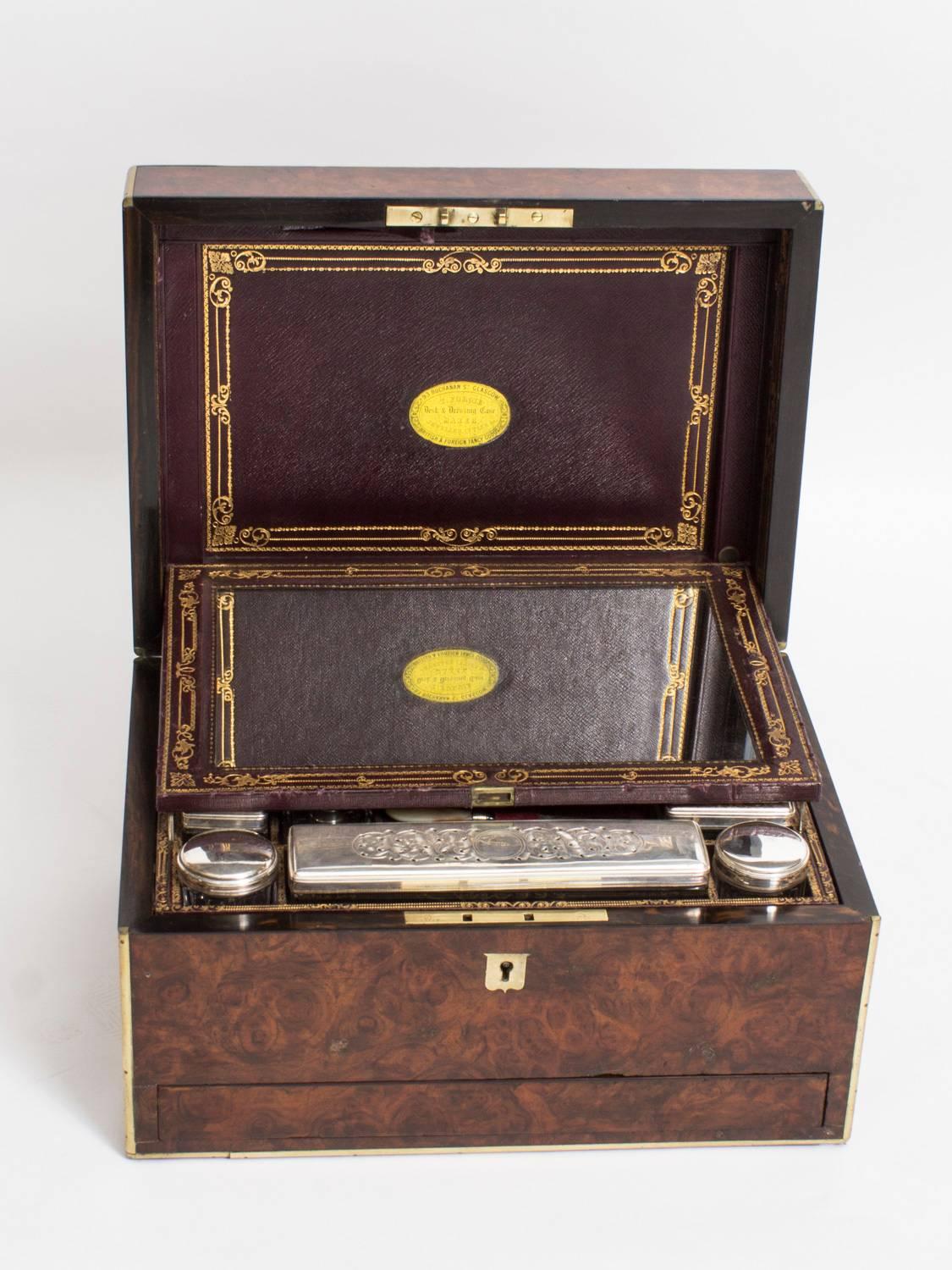 This is a stunning antique Victorian burr walnut and ormolu-mounted rectangular lady's travelling case, retailed by T. Forgie: 93 Buchman St, Glasgow, Scotland, circa 1860 in date.

The spectacular burr walnut case is outlined with brass stringing