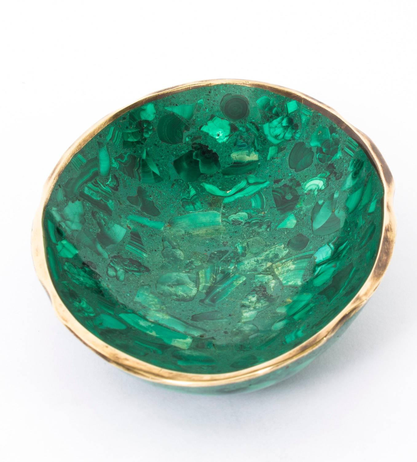 This is a beautiful oval malachite trinket dish circa 1900 in date.

The shallow dish features the distinctive textured pattern of malachite with an ormolu mount finishing off the lip.

Provenance: 
The collection of the late Ronnie Kirkwood