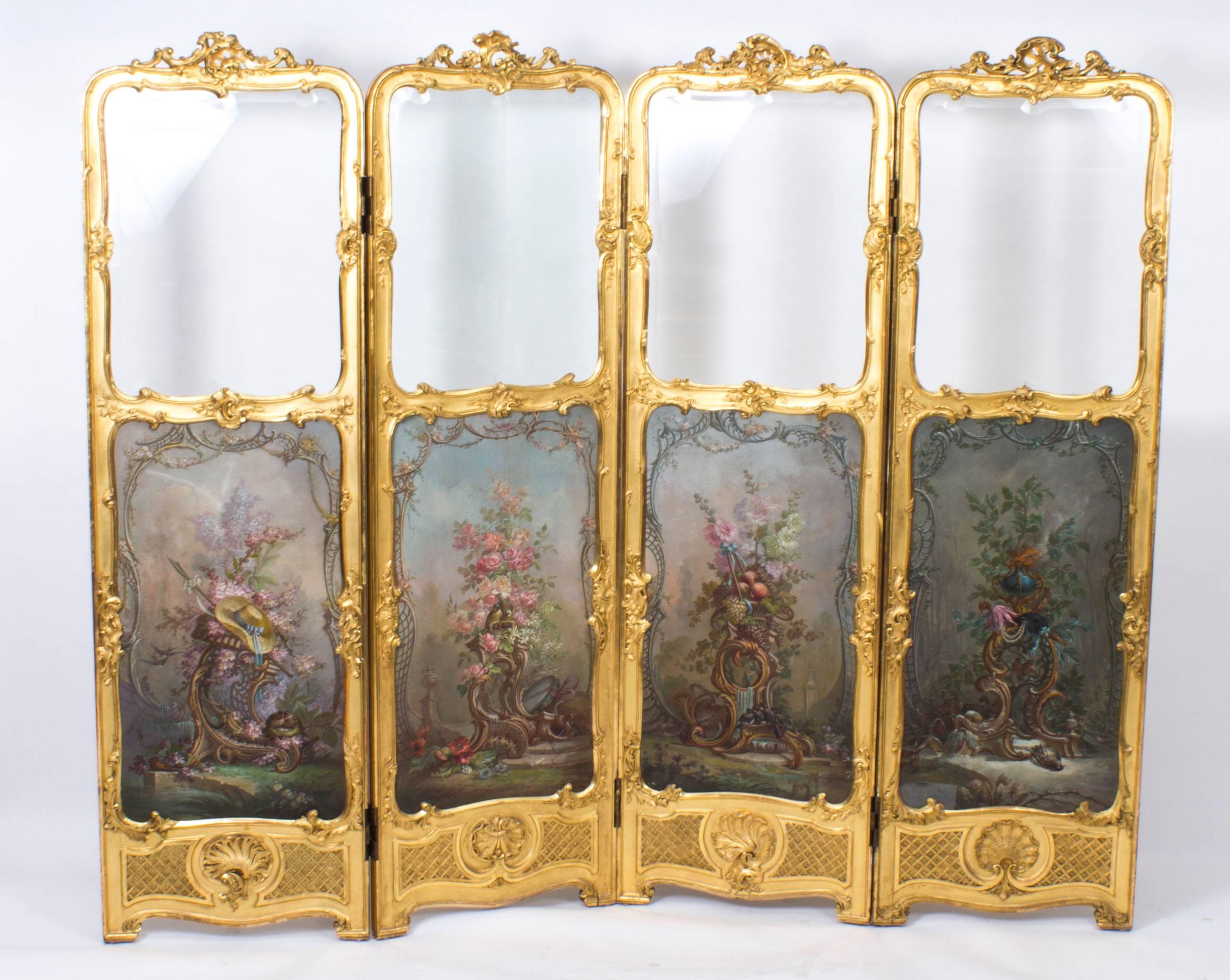 A Louis Revival giltwood four fold screen with painted Vernis Martin panels, circa 1880 in date.

The four fold hinged screen features decorative carved shaped scrolled tops with decorated acanthus and shell mounts. The panels have shaped bevelled