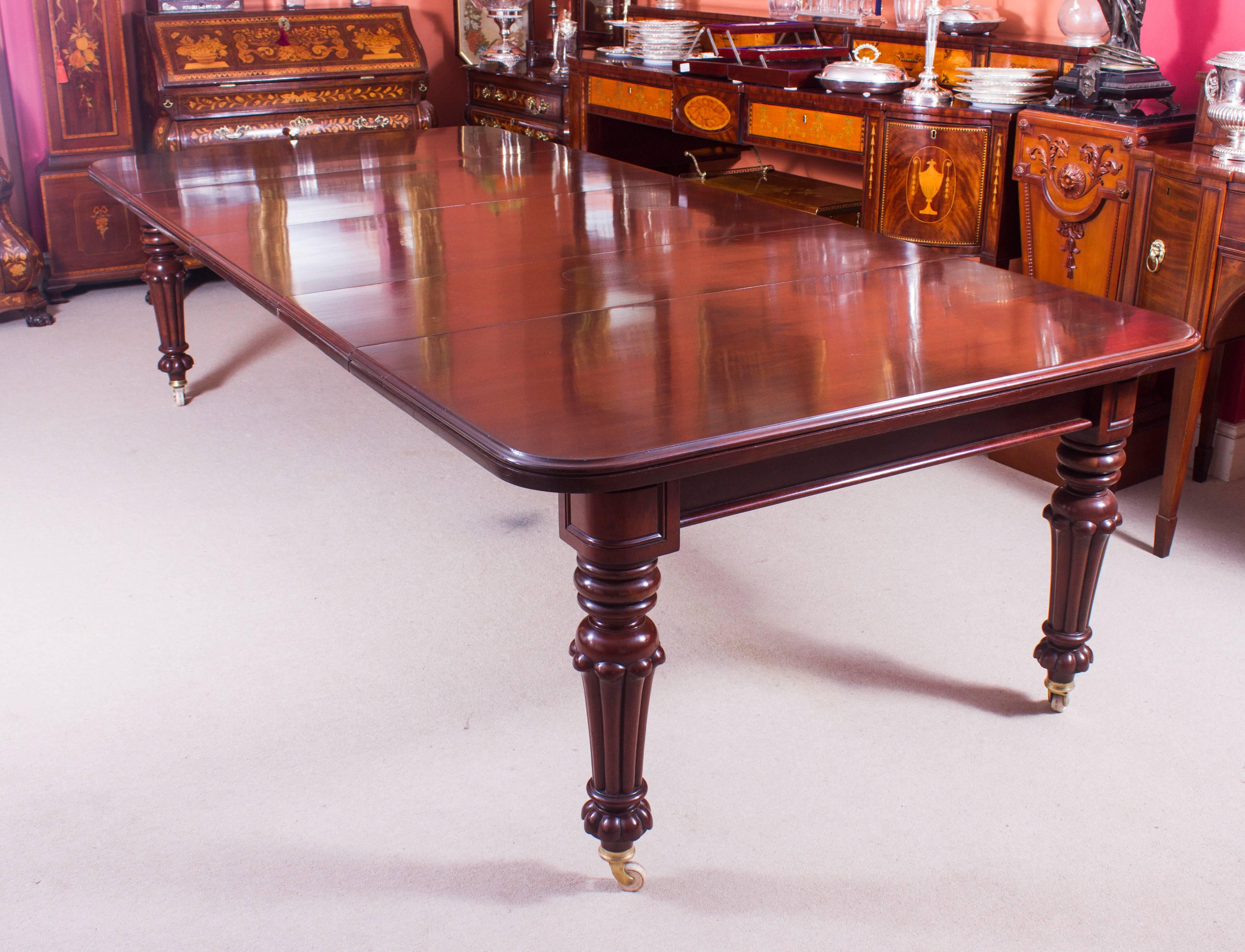 This is a beautiful dining set comprising a beautiful antique Victorian flame mahogany extending dining table, circa 1840 in date and a beautiful set of 12 Vintage swag back dining chairs.

This amazing table can sit twelve people in comfort and