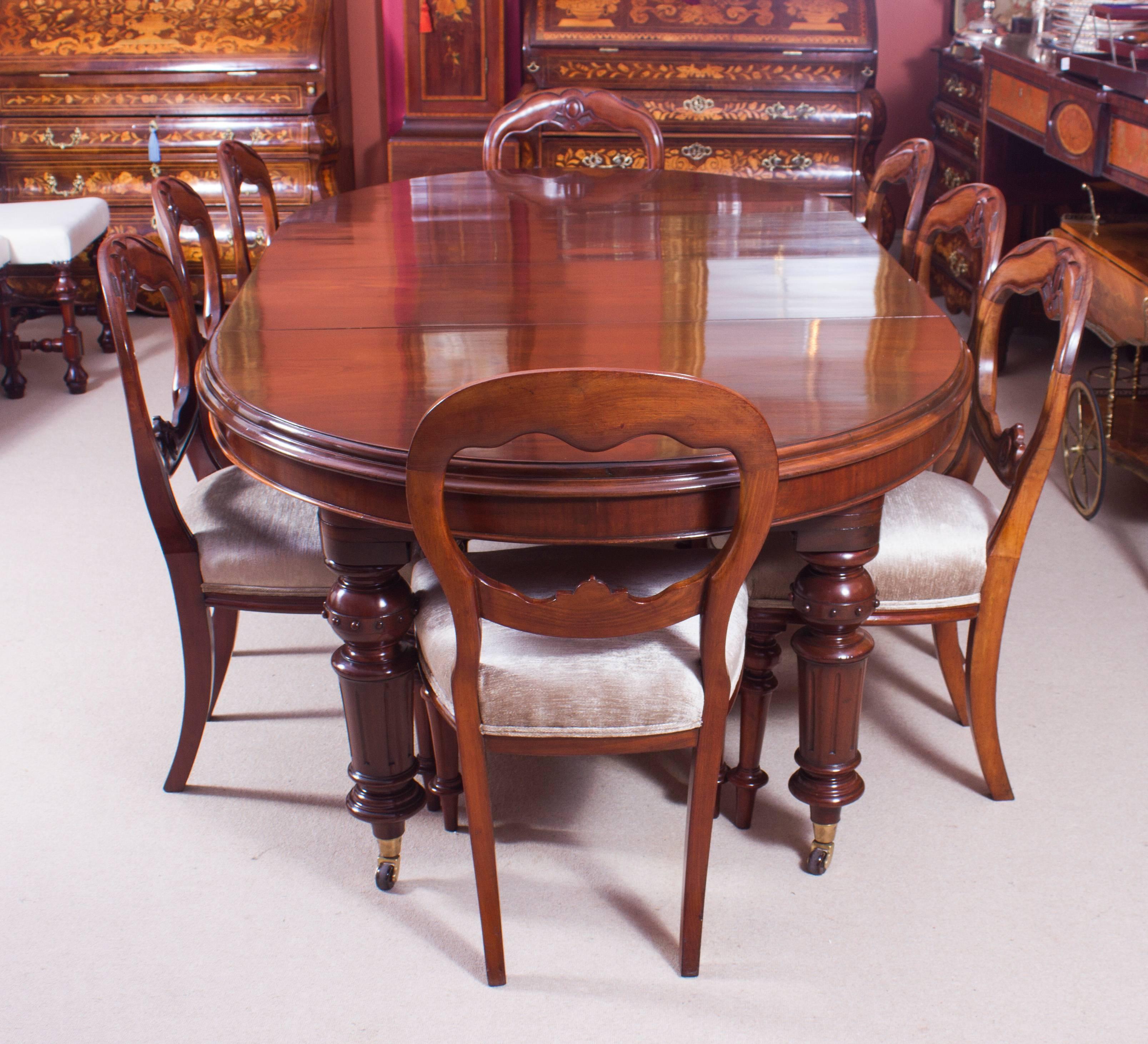 This is a fabulous dining set comprising an antique Victorian mahogany oval extending dining table, circa 1860 in date with a set of eight antique Victorian Balloon Back dining chairs also circa 1870 in date.

The table has two original leaves and