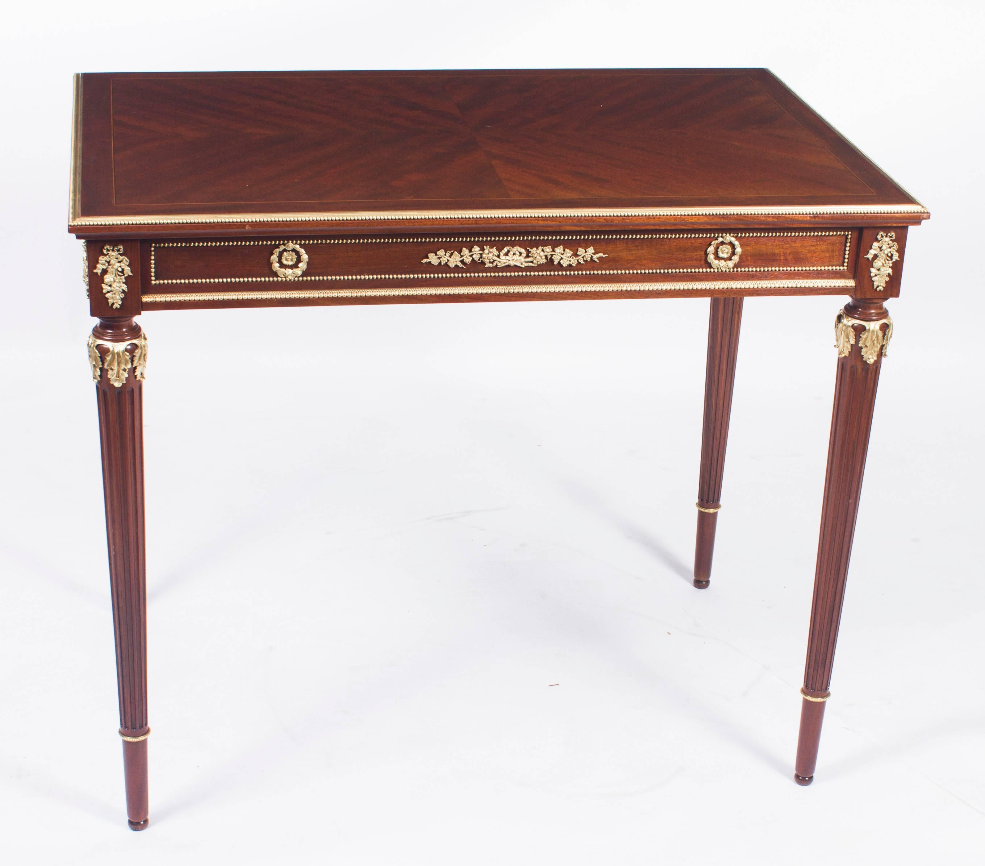 This is a wonderful antique French ormolu-mounted flame mahogany side table, circa 1870 in date.
It has been masterfully crafted from flame mahogany with striking gilded ormolu mounts of the highest quality. It has a useful and capacious frieze