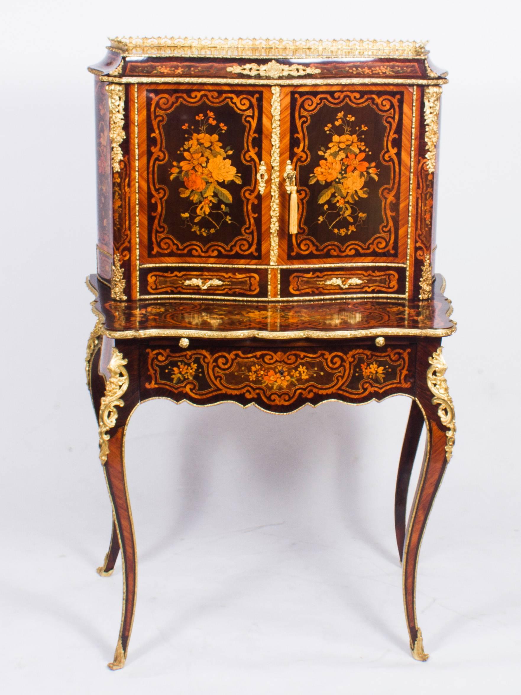 This is a gorgeous Louis Revival French marquetry inlaid ormolu-mounted Bonheur Du Jour, or Ladies writing desk, circa 1860 in date.

The bonheur du jour comprises a pair of serpentine cupboard doors which open to reveal a beautifully finished