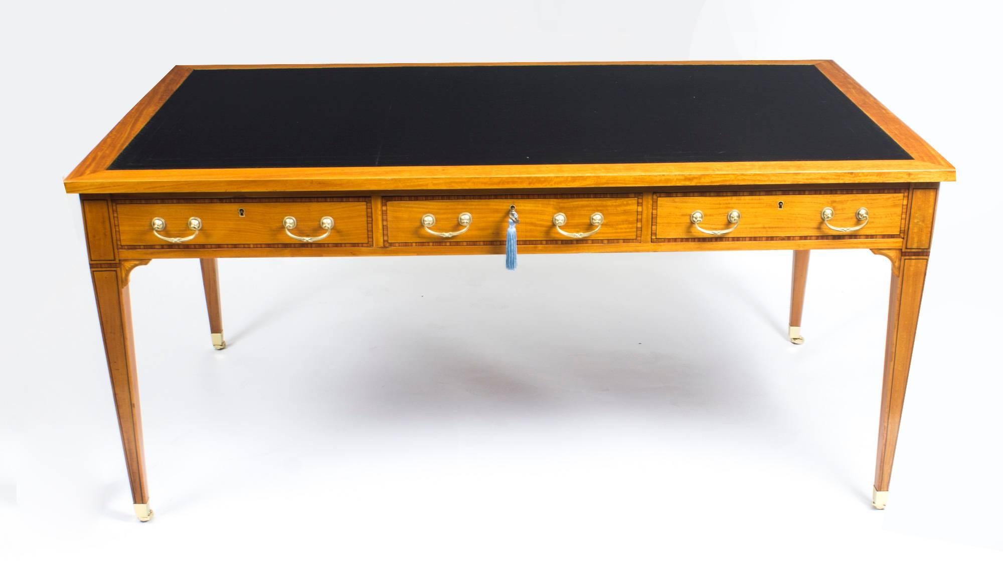 This is a beautiful antique late Victorian satinwood writing table, circa 1880 in date.

This superb quality desk is made from stunning satinwood which has been crossbanded in Kingwood with wonderful ebony line inlaid stringing and it is finished