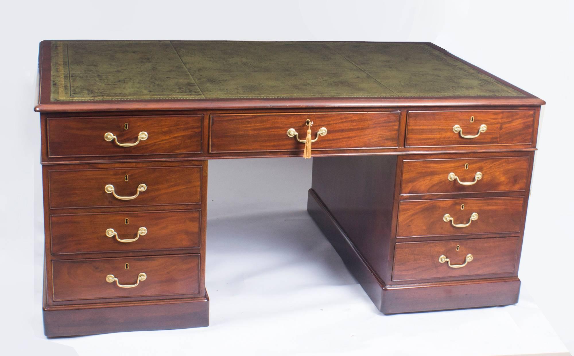 This is a beautiful antique George III flame mahogany partners desk, with nine drawers on each side, circa 1820 in date.

The desk is a partners desk so it is fitted with three frieze drawers and six further pedestal drawers on each side. The top
