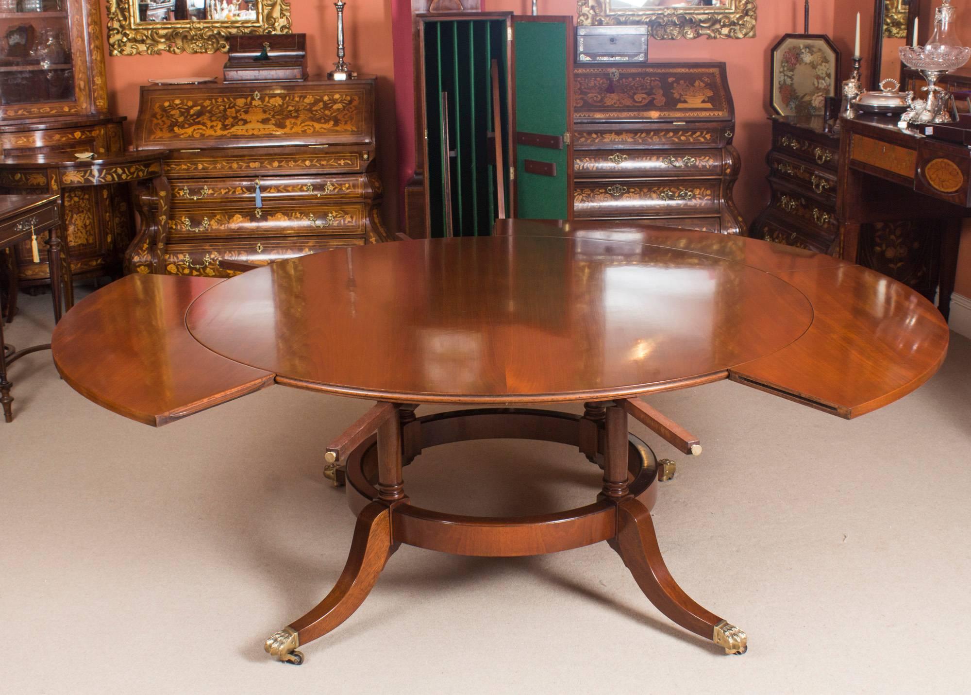 English Vintage Mahogany Jupe Dining Table, Leaf Cabinet and Ten Chairs