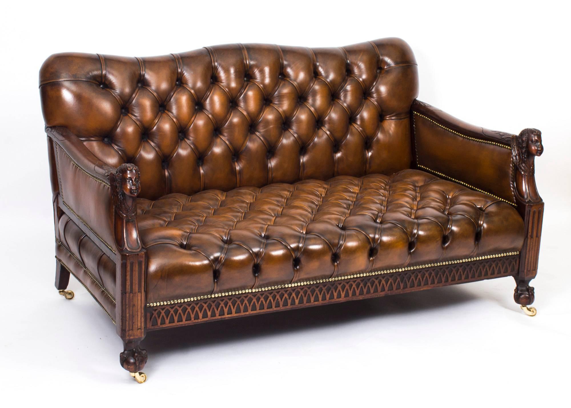 This is a superb antique English Victorian salon suite, comprising a sofa with the matching pair of armchairs, circa 1880 in date.

This suite was made from masterly crafted hand carved solid walnut.

The shape swayed button backs and seats are