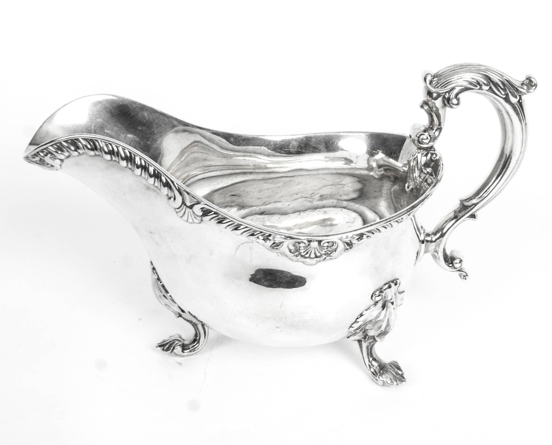 This is a wonderful pair of English antique silver sauceboats. They have hallmarks for London, 1846 and the makers mark of the celebrated silversmith to the crown Robert Garrad.

There is no mistaking their unique quality and design, which is sure