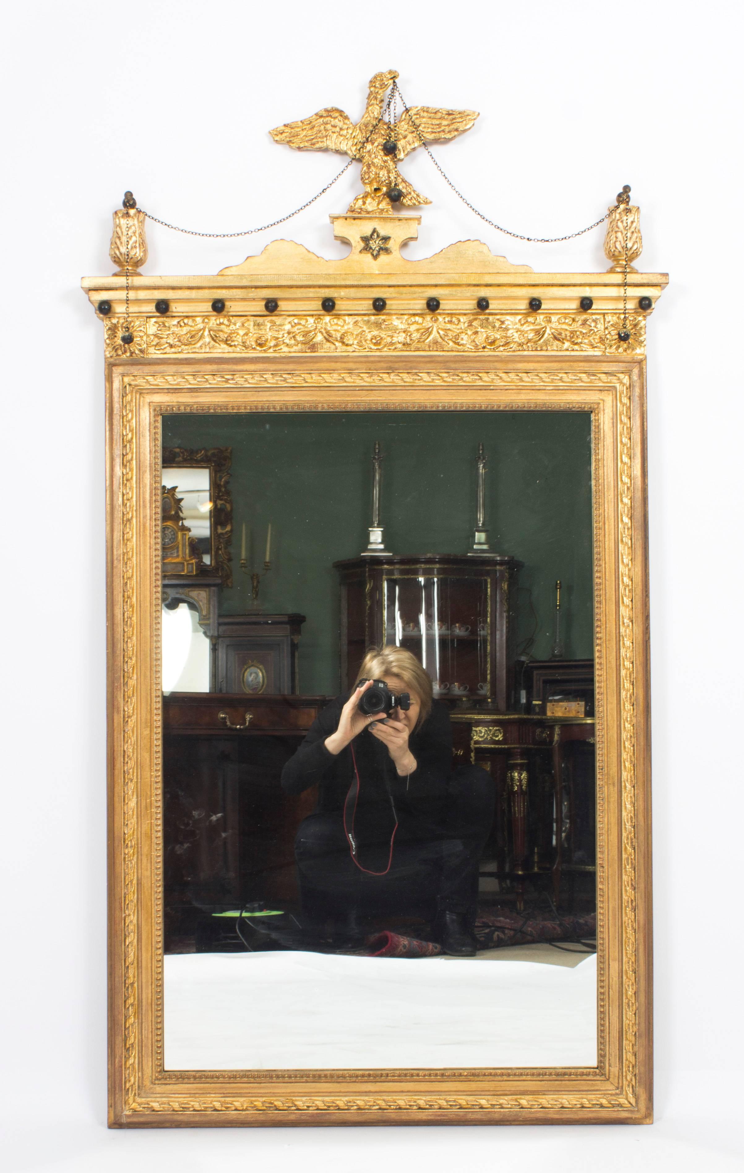 This is a beautiful antique George III style parcel gilt wall mirror, circa 1860 in date. 

The mirror has a beautiful rectangular shape decorated with a beaded egg and dart frame. The decorative cornice has ball and anthemion mounts, the top