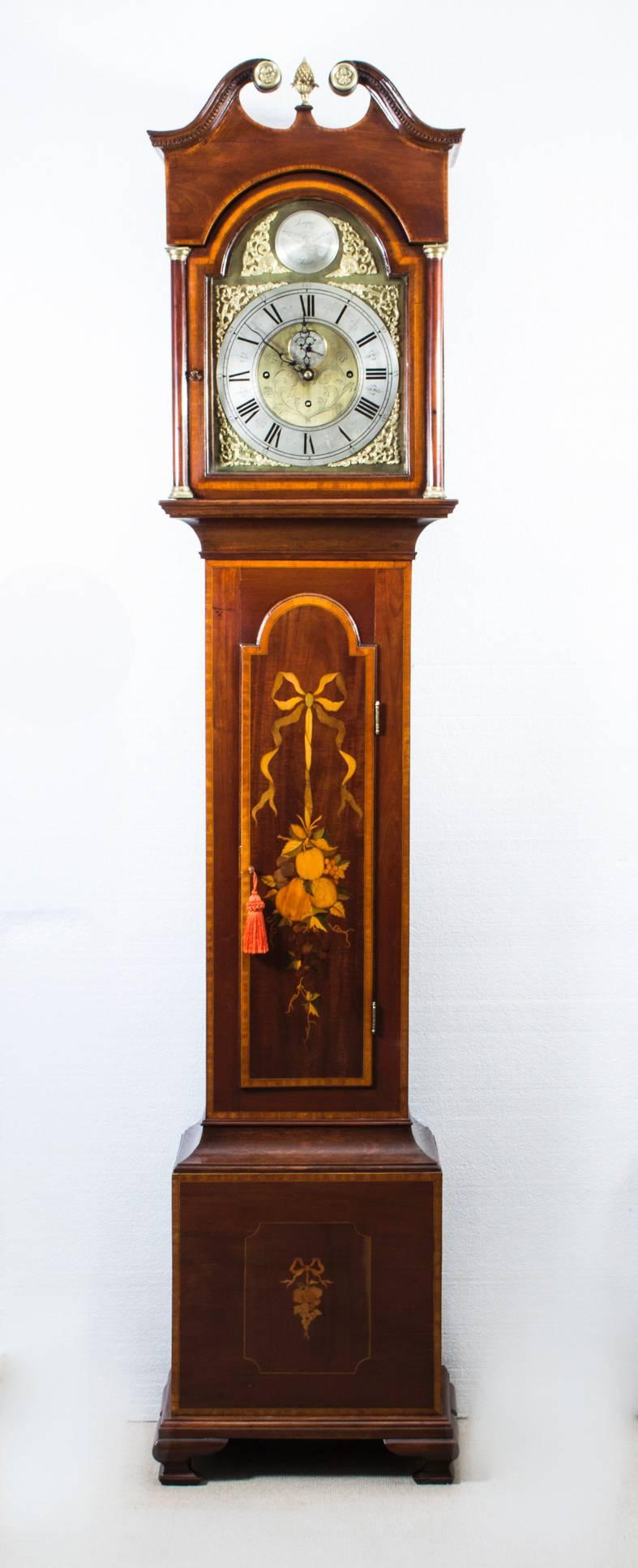 This is a beautiful antique late Victorian, marquetry, mahogany, 8 day, musical chiming longcase clock circa 1880 in date.
 
It has an eight-day three train movement, an arch dial and musically chimes the Westminster tune on 8 bells each quarter