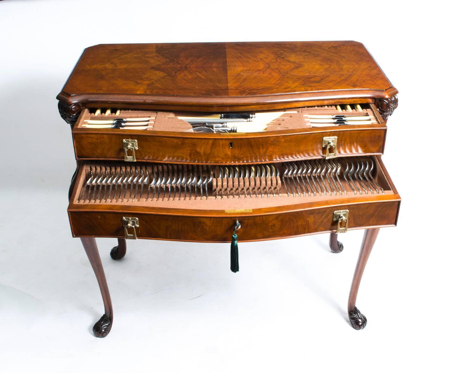 This is a huge canteen comprising 136 pieces of cutlery by James Deakin & Sons, Sheffield.

It is housed in its beautiful original antique, solid walnut and burr walnut, fully fitted cabinet. It has two beautifully fitted drawers with original