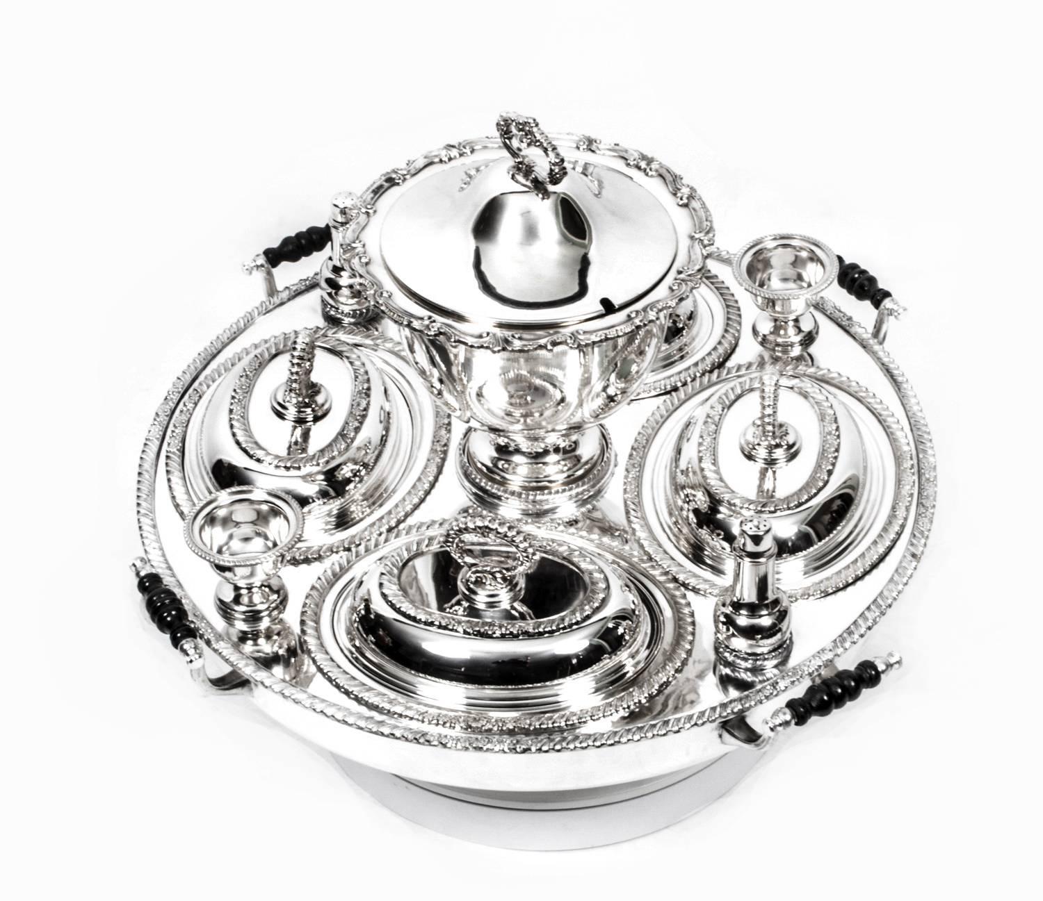 This is a superb antique American silver plated "Lazy Susan," which is a rotating serving tray, dating from the 1920s.

This versatile piece features four lidded entree dishes, a pair of salts and a pair of pepper shakers, as well as a