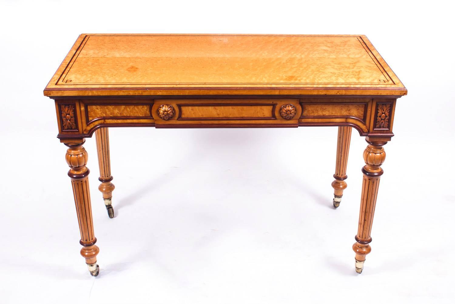 This is a superb quality bird's-eye maple writing table in Gillows style, having a useful frieze drawer, on elegant tapering fluted legs.

We cannot find a Gillows stamp on this item, but the quality is such that I have no hesitation in