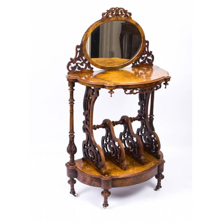 This is a gorgeous antique Victorian burr walnut Canterbury Whatnot circa 1860 in date. 

The grain of the burr walnut is truly beautiful and the solid walnut fret carved sides and dividers are a masterpiece of the Victorian cabinet makers art. It