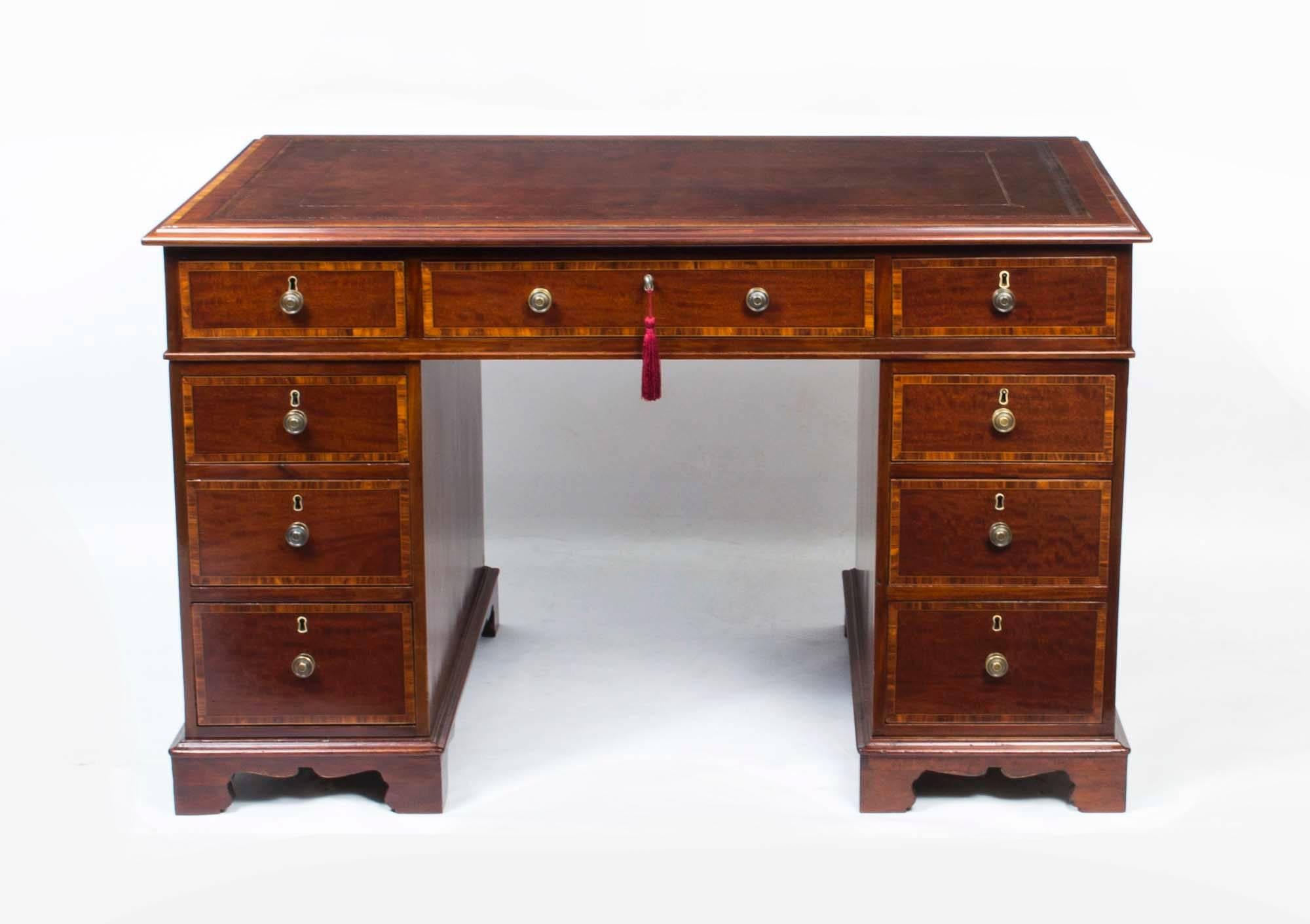 This is a superb antique Victorian flame mahogany and kingwood crossbanded pedestal desk, circa 1860 in date.

It is made from fabulous flame mahogany, the rectangular mustard brown tooled leather inset is original, and the top features an elegant