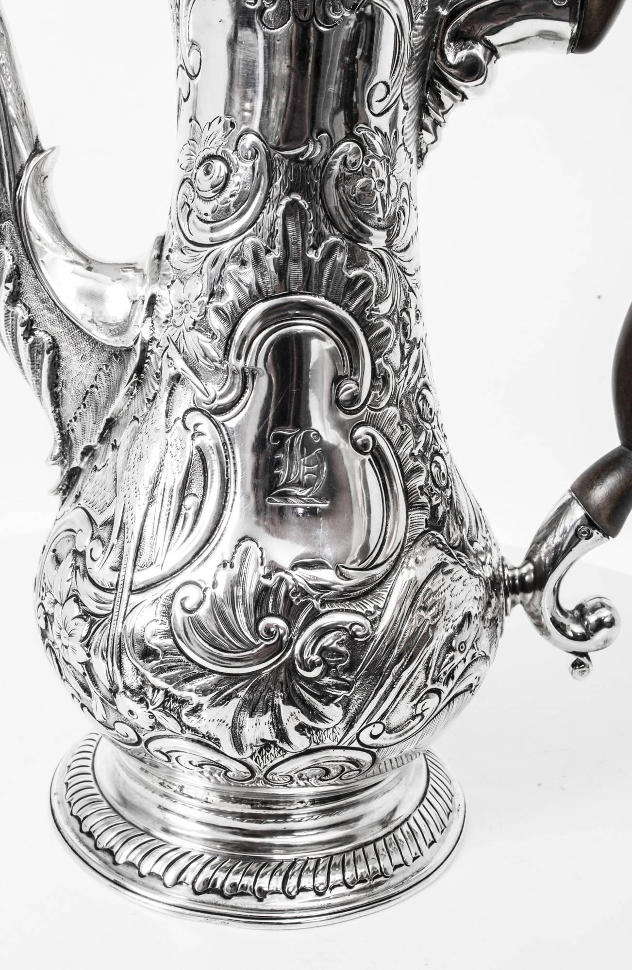 This is a wonderful antique English George III sterling silver coffee pot with hallmarks for London 1767 and the makers mark of W & J Priest, the renowned London silversmiths William Priest & James Priest.

This coffee pot is of very elegant