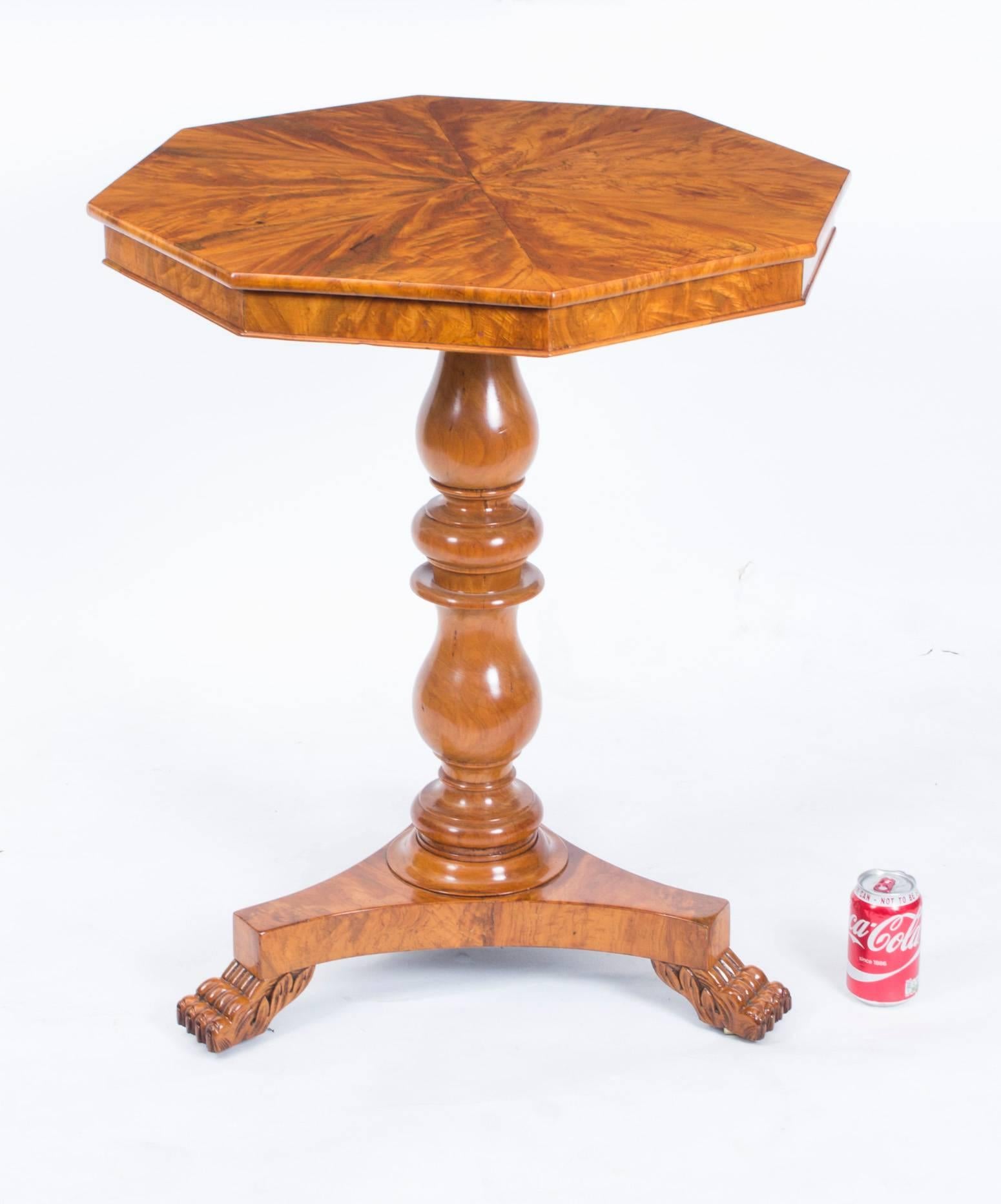 This is a beautiful antique French Louis Philippe octagonal satinwood and fruitwood occasional table, circa 1820 in date. 

The octagonal top has been accomplished using the very best satinwood veneers in a stunning starburst pattern and the stem