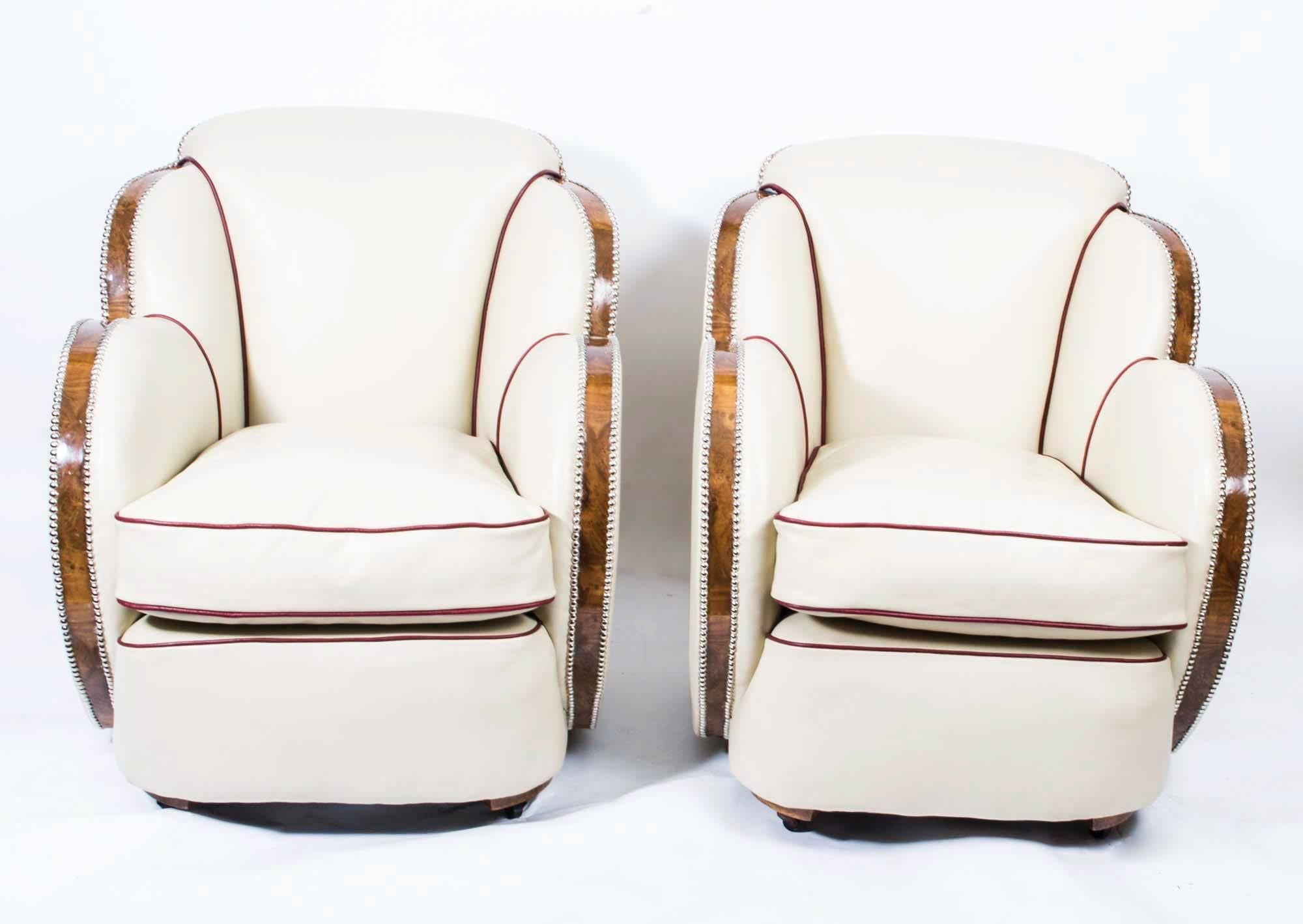 This is a stunning and rare pair of original antique 1930s Art Deco cloud back armchairs by Epstein.

Each armchair is cloud shaped with a comfortable cushion seat and beautiful burr walnut show wood.

Both have been stripped back to a bare