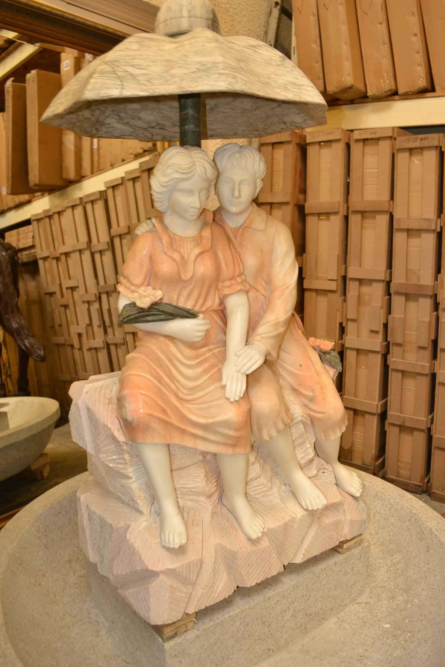 This is a charming multi-coloured marble fountain statue of two lovers sheltered under an umbrella, dating from the last quarter of the 20th century.

This magnificent work of art is hand-carved from solid blocks of Italian Carrara marble.

The