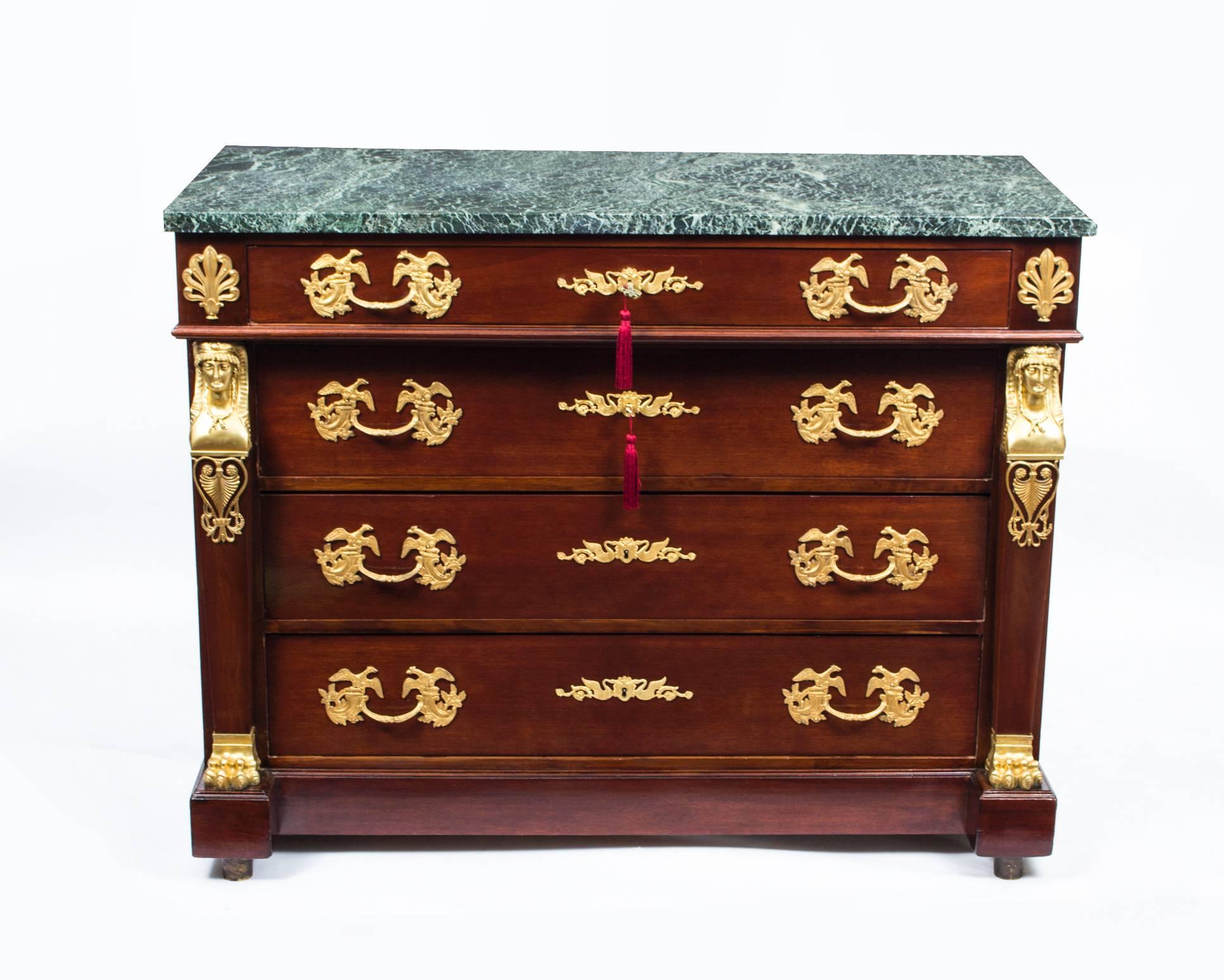 This stunning antique French Empire commode in the fabulous Empire manner, circa 1880 in date was crafted from the most beautiful mahogany.

It has four large and capacious full width drawers which have the most wonderful ormolu handles,