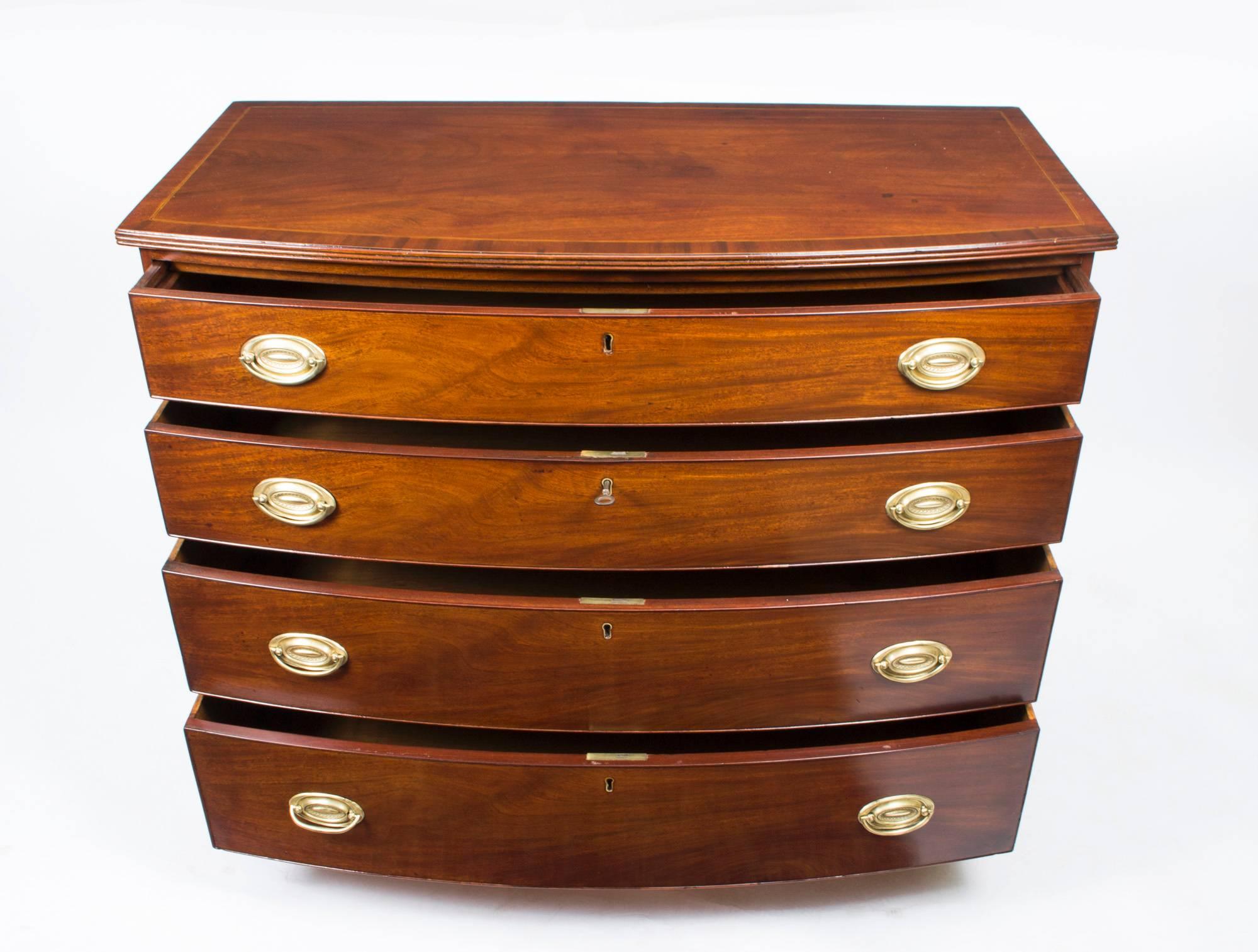 This is beautifully crafted antique George III mahogany bow fronted chest of drawers, circa 1790 in date. 

This antique chest is made from the finest quality flame mahogany, you can see the beautiful grain of the wood.

There are four capacious