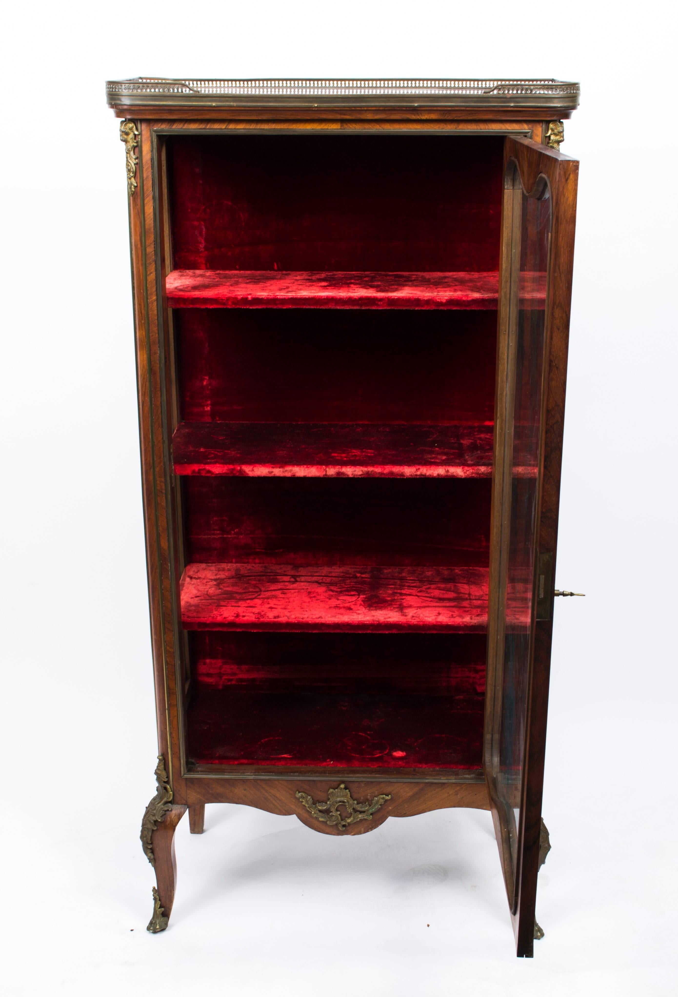 This is a beautiful antique French kingwood and ormolu-mounted display cabinet in the French Louis XV manner, circa 1880 in date.

This beautiful cabinet has superb floral marquetry decoration and an abundance of exquisite ormolu mounts.

It has