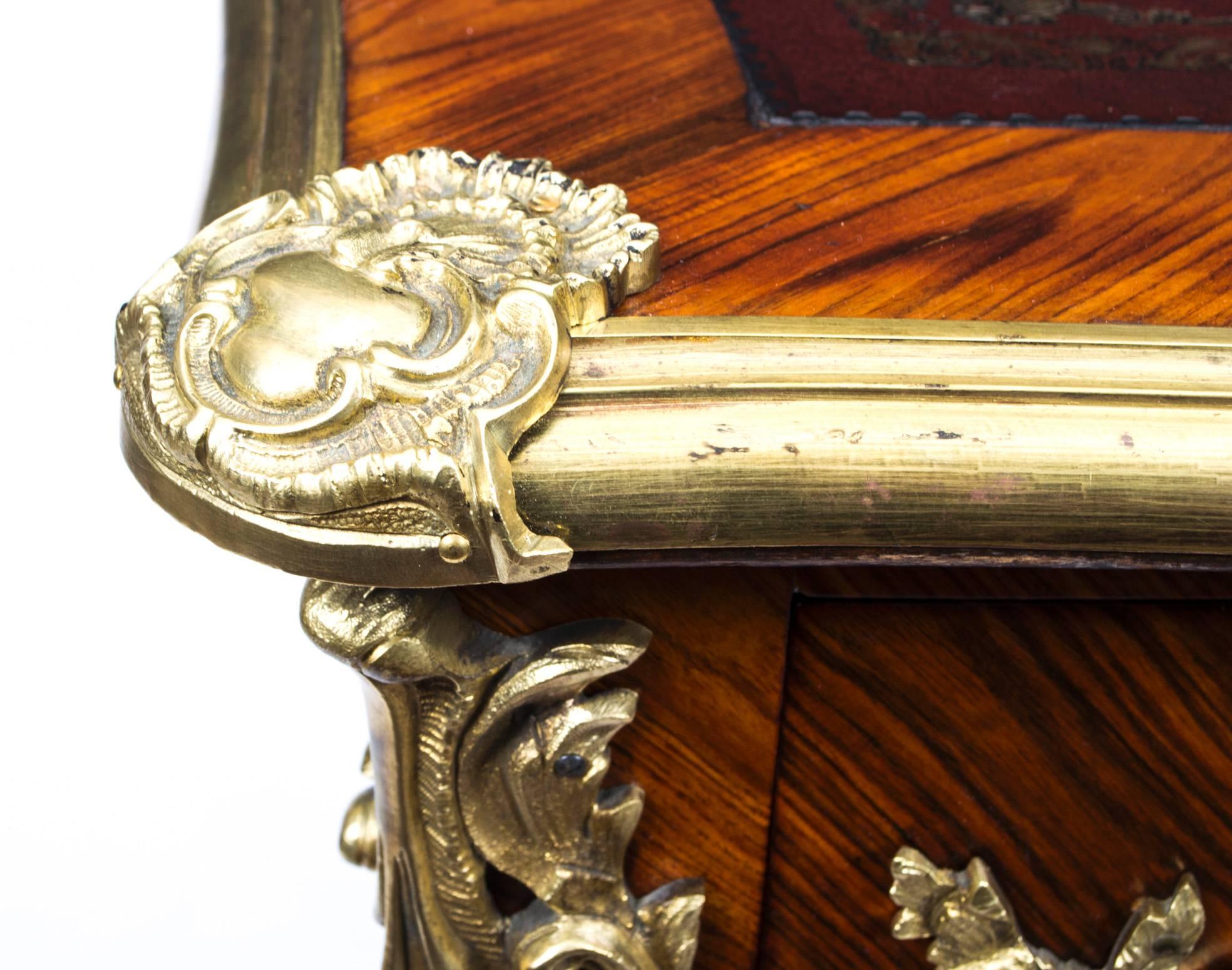 A 19th century Louis XV style kingwood Bureau Plat with brass edging to the shaped top, fitted three drawers on cabriole supports with ormolu mounts having scallop motifs and paw feet, 4ft 3in x 2ft 2in

This is a gorgeous antique French ormolu