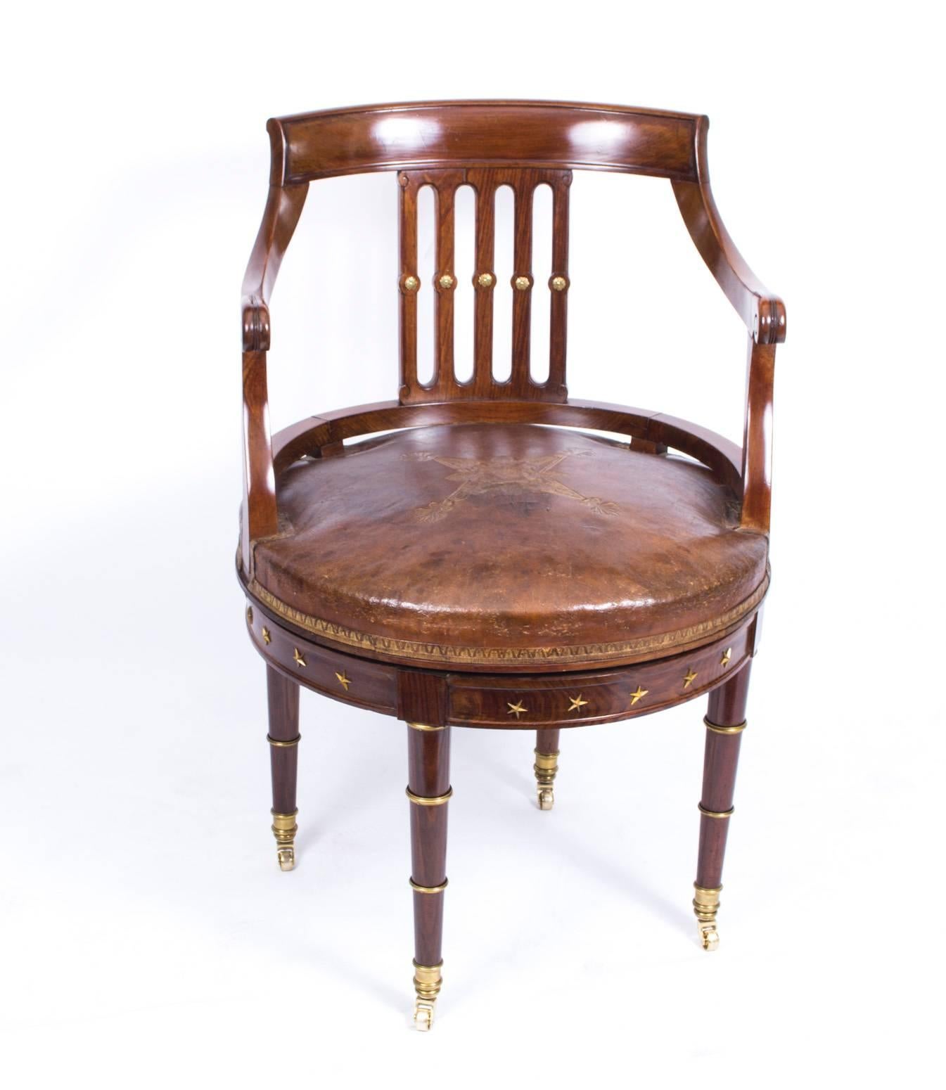 This is a beautiful antique and very comfortable French Empire mahogany revolving desk chair, circa 1870 in date.

The mahogany is beautiful in colour and has been embellished with striking and decorative ormolu mounts. The original gold embossed