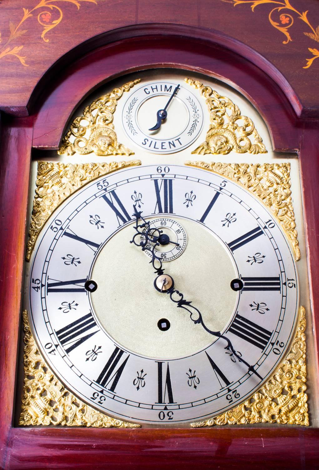 This is a stunning English antique Victorian, mahogany and inlaid 8 day, 5 tube longcase clock, circa 1880 in date.

It has a beautiful brass decorative breakarched dial with silvered chapter ring and gilded spandrels. With a secondary dial