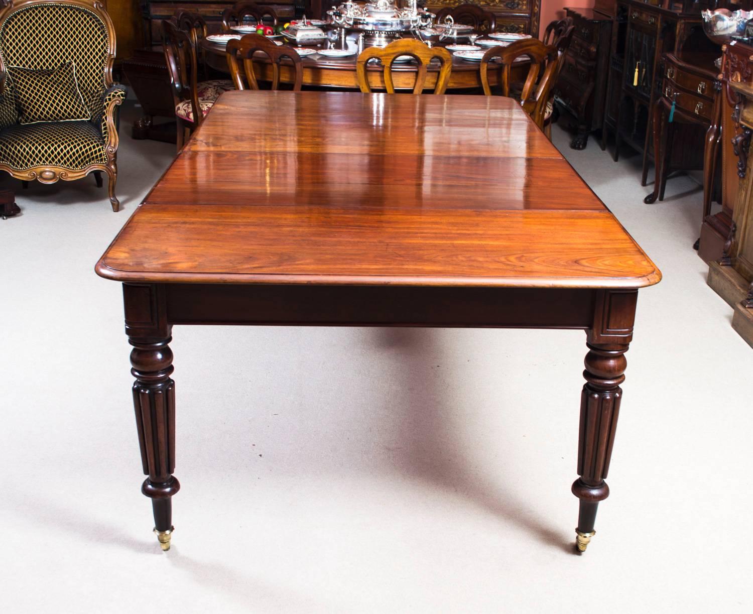 A very rare opportunity to own an antique English Regency dining room table in the manner of Gillows, circa 1820 in date, with a set of eight vintage admiralty back dining chairs.

This amazing table has two original leaves, can sit eight people