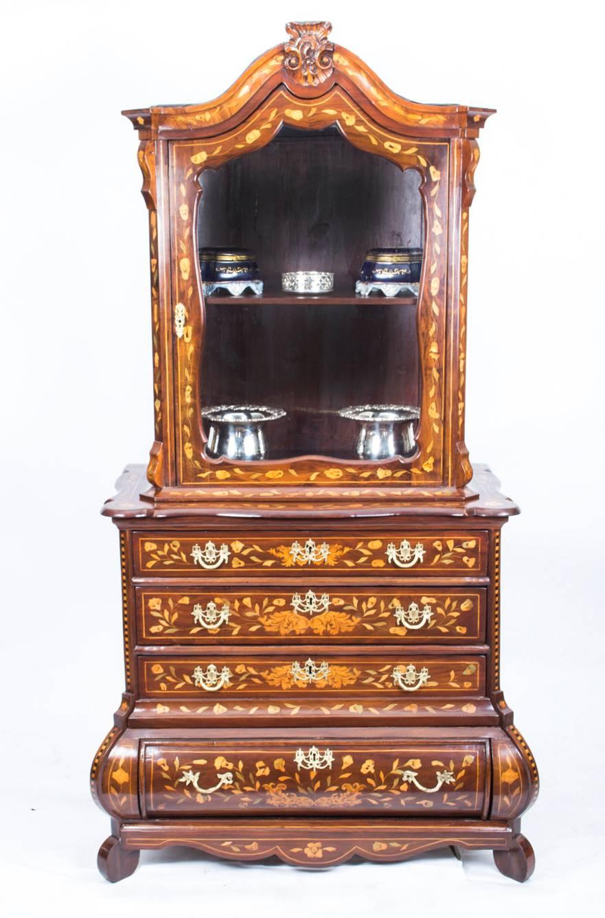 This is a superb antique Dutch marquetry walnut cabinet on chest, circa 1780 in date.

It has been accomplished in walnut with exquisite hand-cut walnut, boxwood and fruitwood floral marquetry typical of the period.

The cabinet has a single glazed