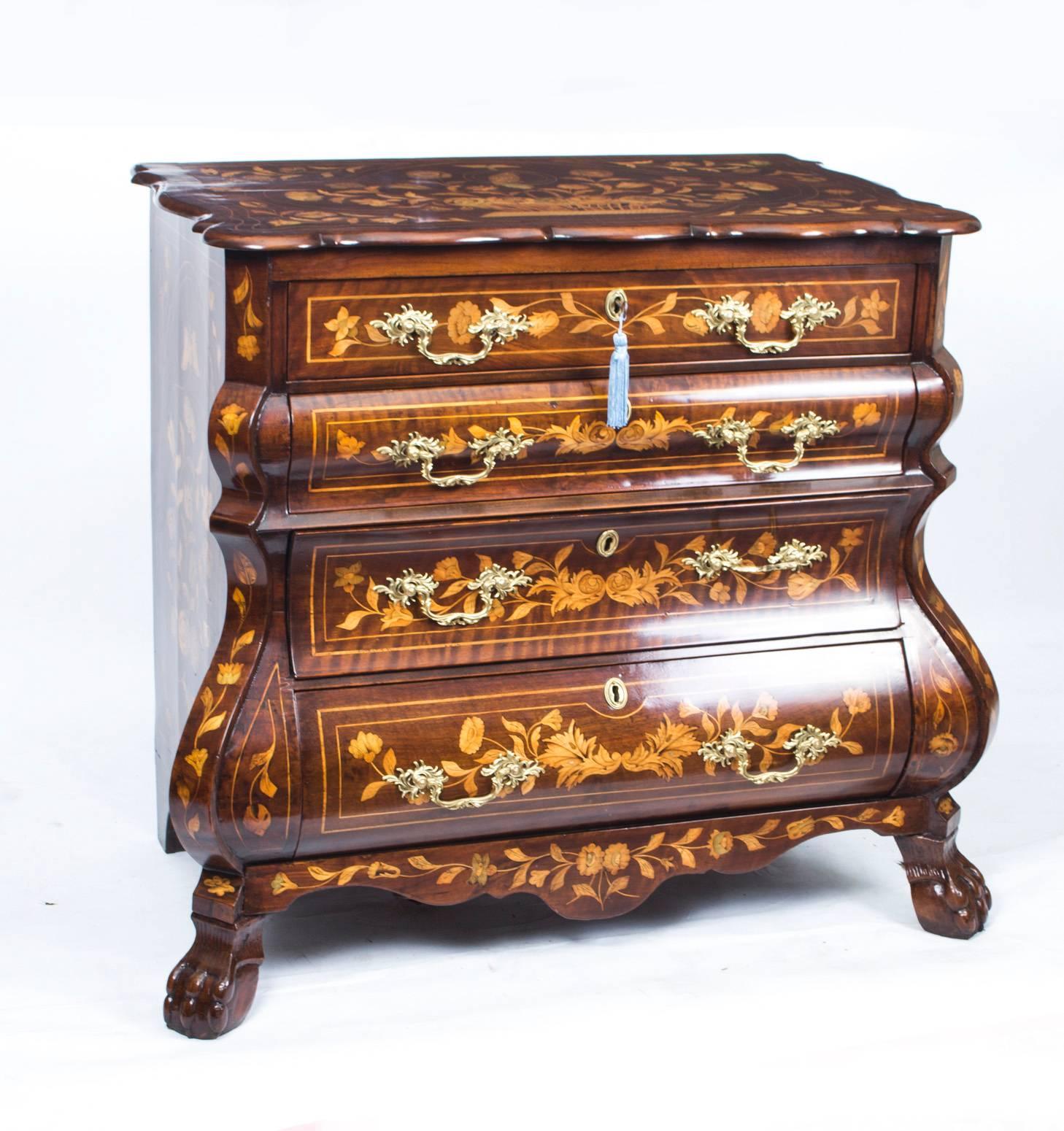 This is a stunning antique Dutch bombe' serpentine fronted marquetry chest of drawers, circa 1770 in date.

It has been accomplished in burr walnut with exquisite hand-cut walnut, boxwood and fruitwood floral marquetry typical of the