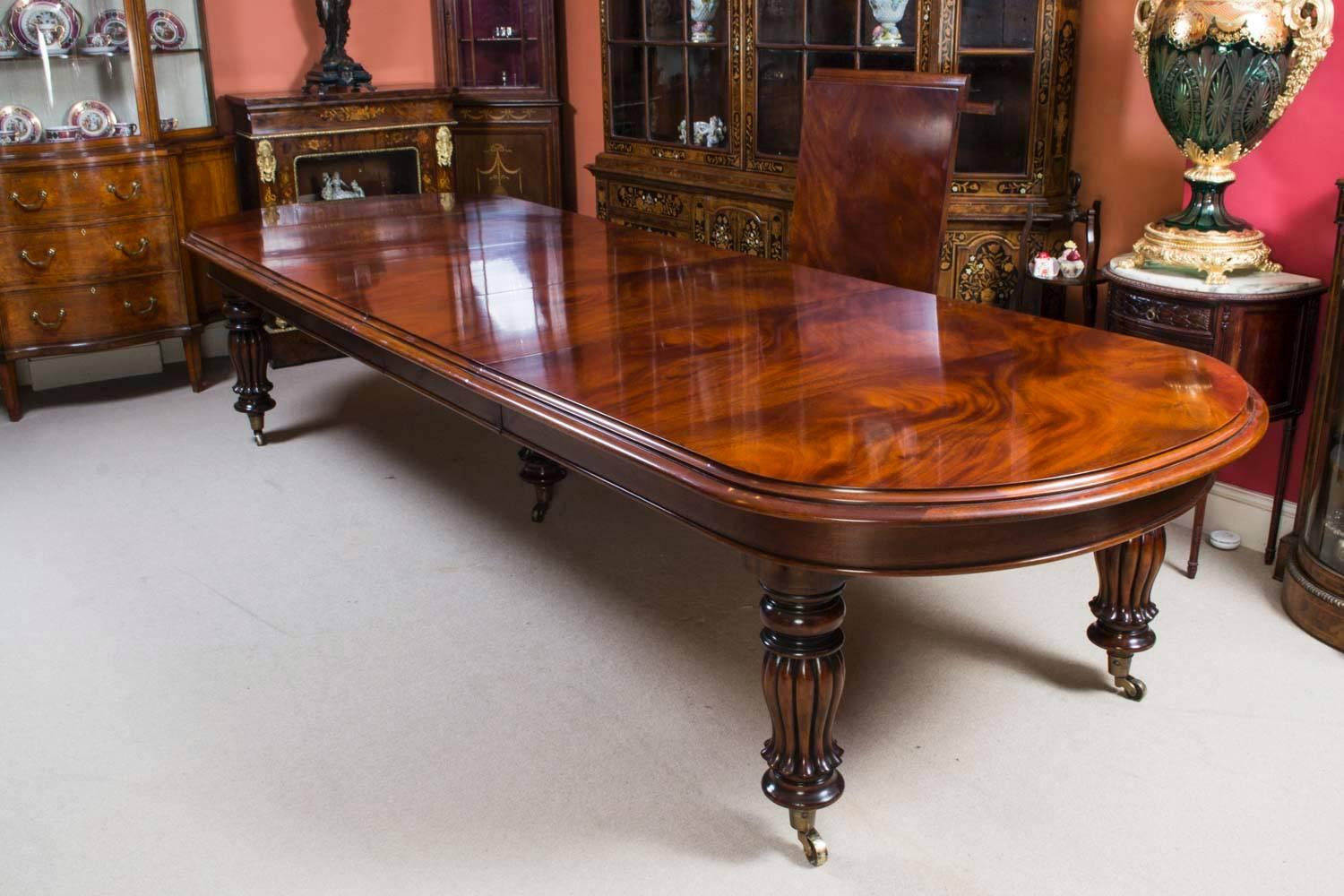 This is a magnificent vintage Victorian style mahogany dining table which can seat fourteen diners in comfort and is also ideal for use as a conference table.

This beautiful table is in stunning flame mahogany and has three leaves of