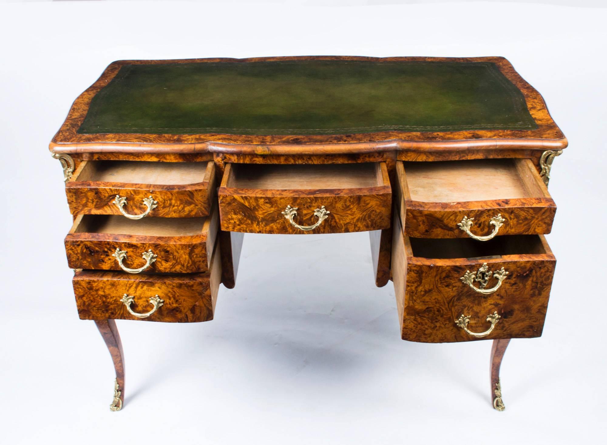 A gorgeous antique French ormolu-mounted Pollard oak desk, circa 1850 in date.

Featuring Pollard oak of wonderful color and of the very highest quality, with its striking sinuous serpentine sides this table is sure to get noticed wherever it is