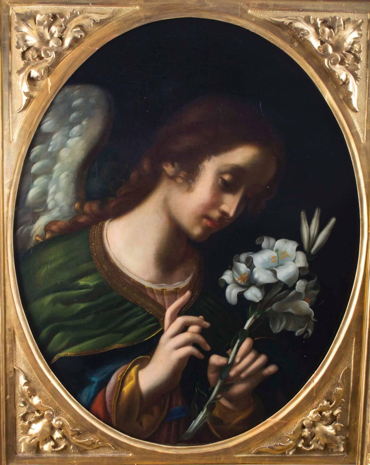 This is a beautiful oval oil on canvas depicting the Angel of the Annunciation, Italian School, circa 1860 in date, after the original by Carlo Dolci (1616-1686), in the Palazzo Pitti, Florence.

The painting is housed in an elegant giltwood